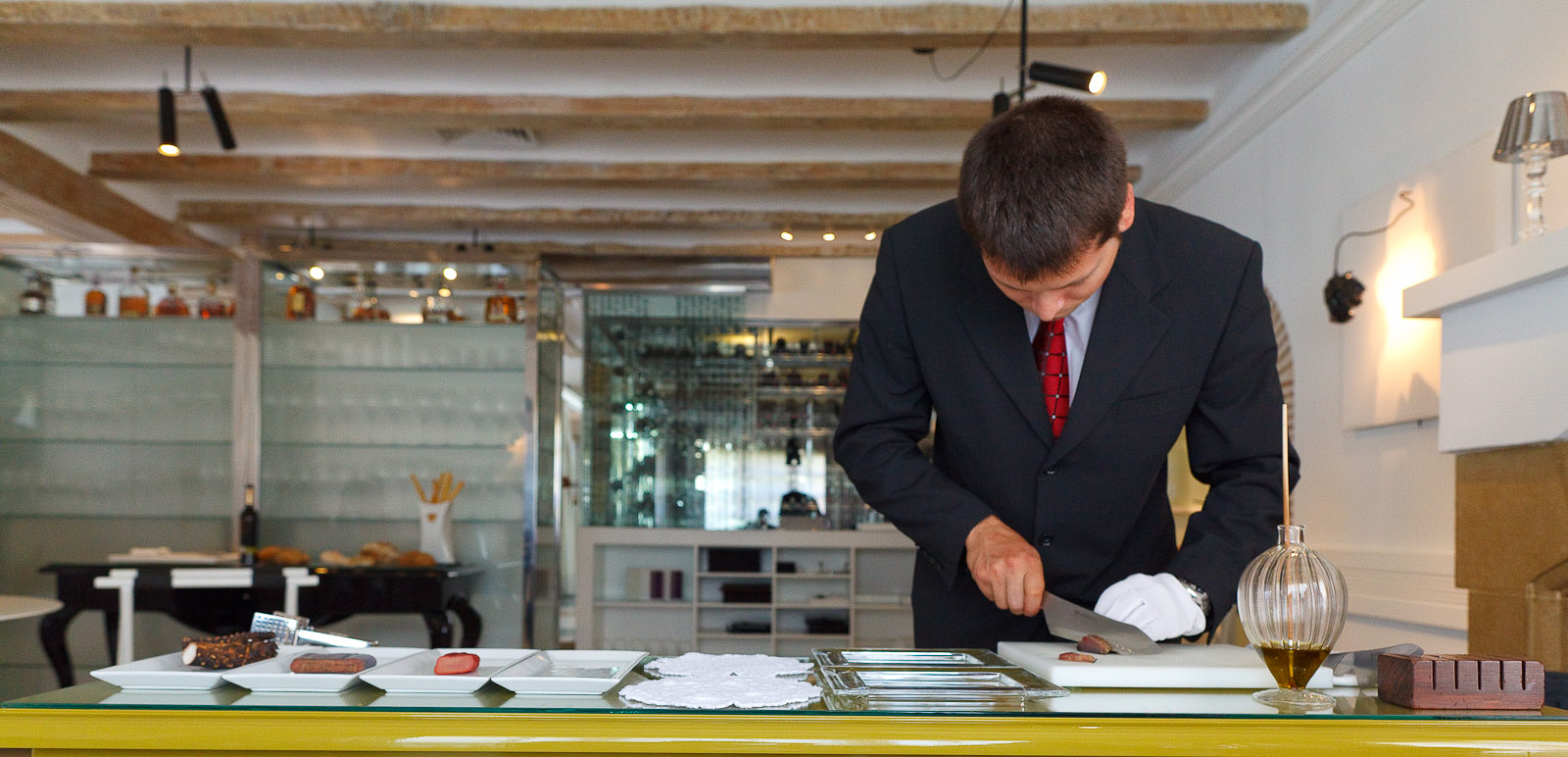 Slicing the first course: "Table of delicatessens," an assortment of cured fish roe