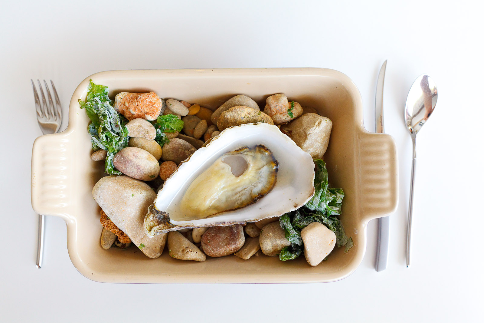 10th Course: Warm oyster served on hot rocks in natural water.