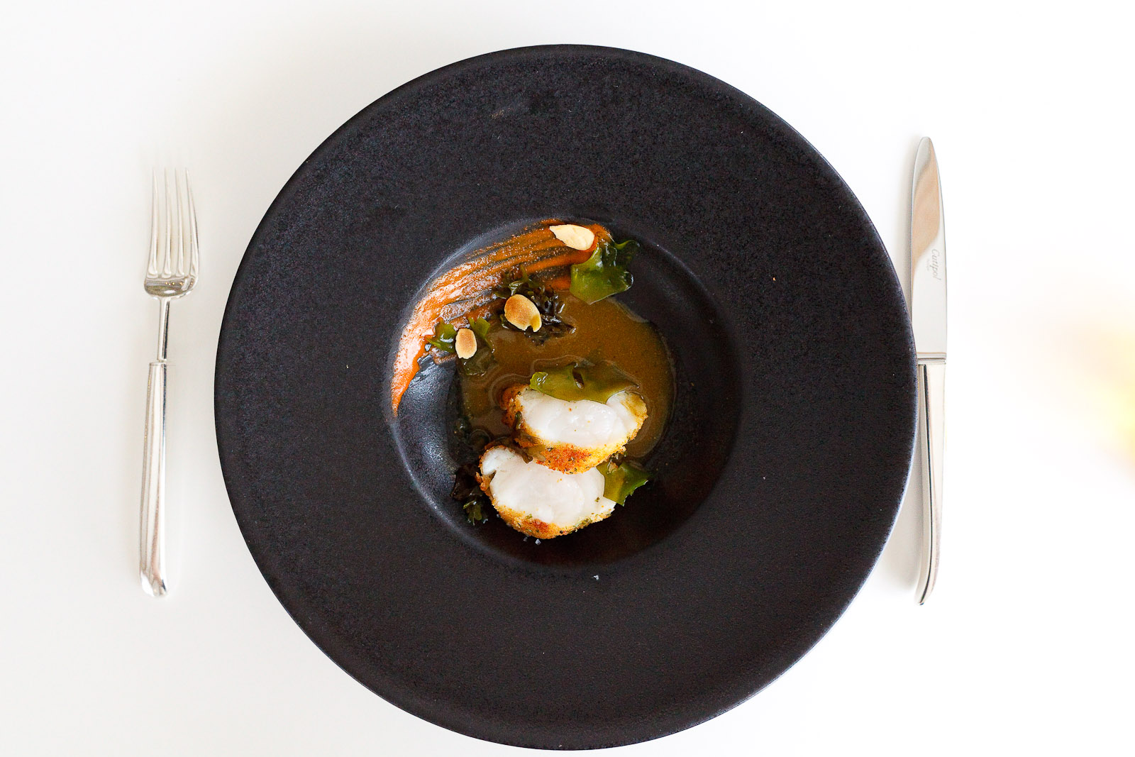 15th Course: Breaded monkfish in seaweed sauce, almonds.