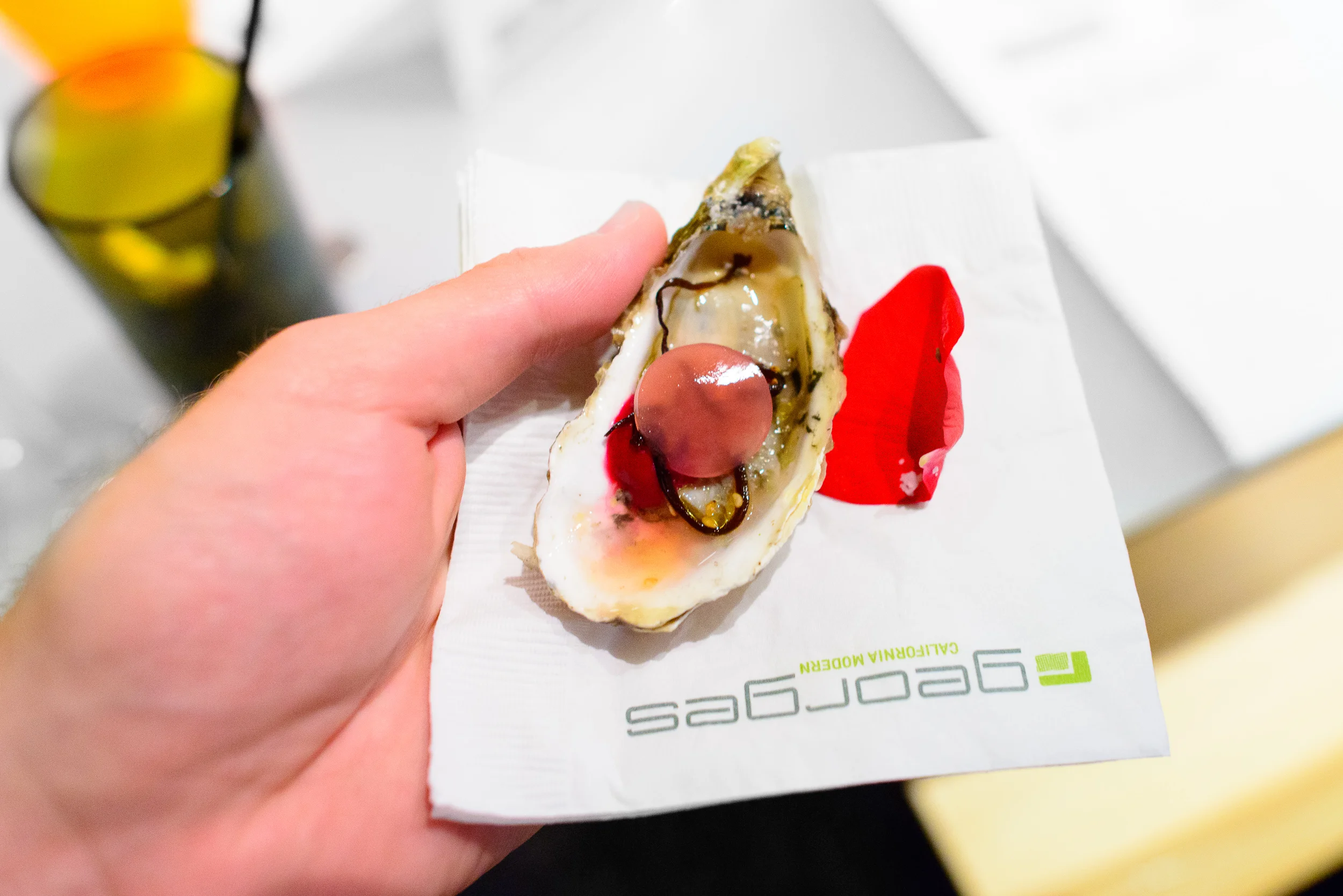 Snack 1: Oyster, rose, smoked beet. By Trey Foshee.