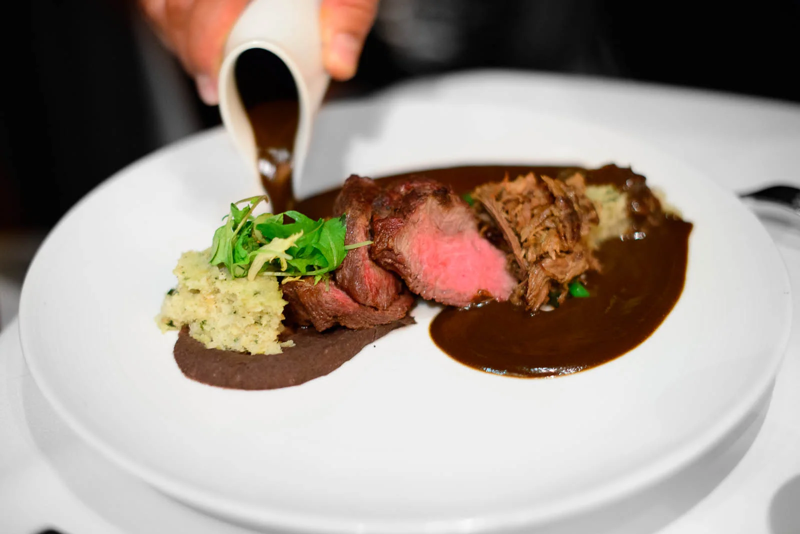 Carne Asada y Barbacoa en Mole Negro: Seared Premier Wagyu ribey