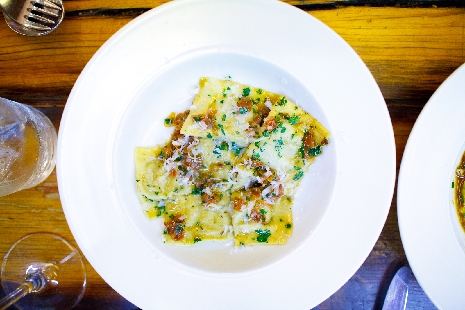 Ravioli filled with salsify, topped with jamón serrano