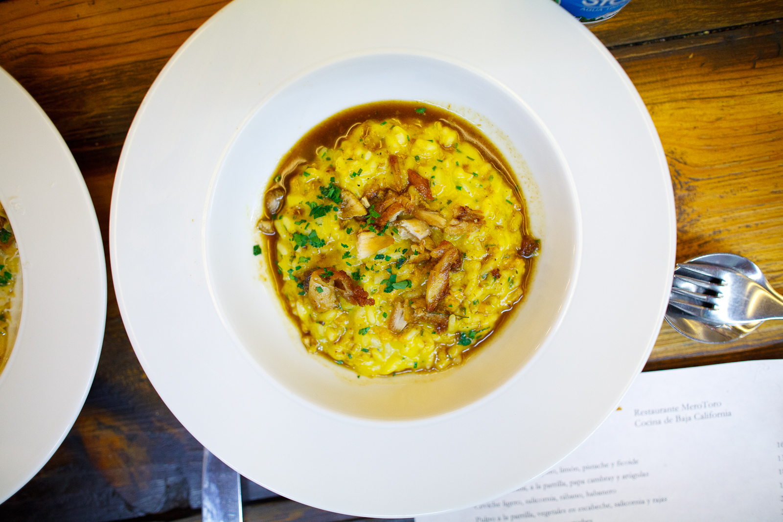 Creamy rice with squash and sea urchin, topped with crispy chicken and habanero pepper