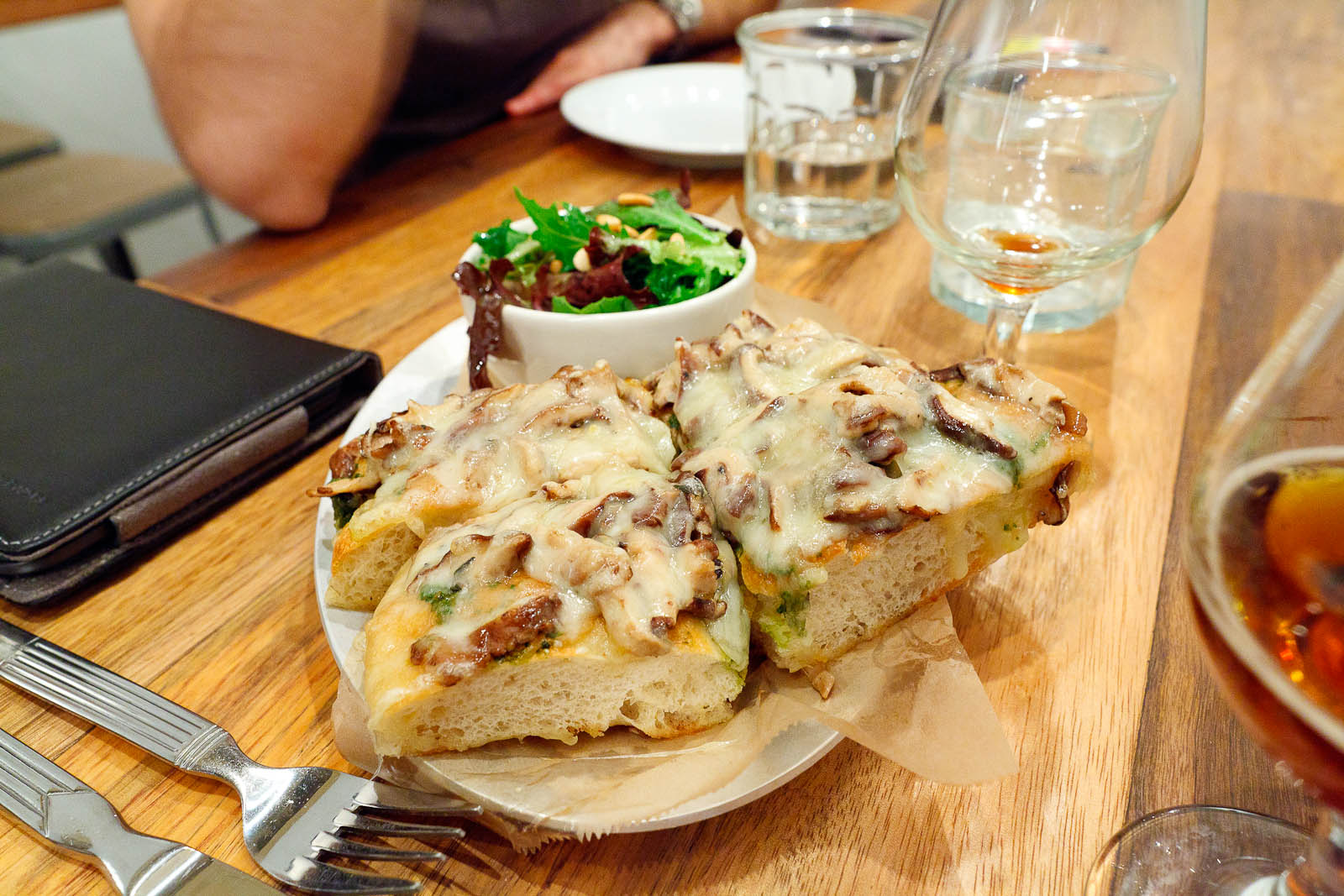 Fontina Val d'Aosta - Marinated mushrooms and basil pesto open-face on focaccia with green salad and toasted pine nuts ($11)