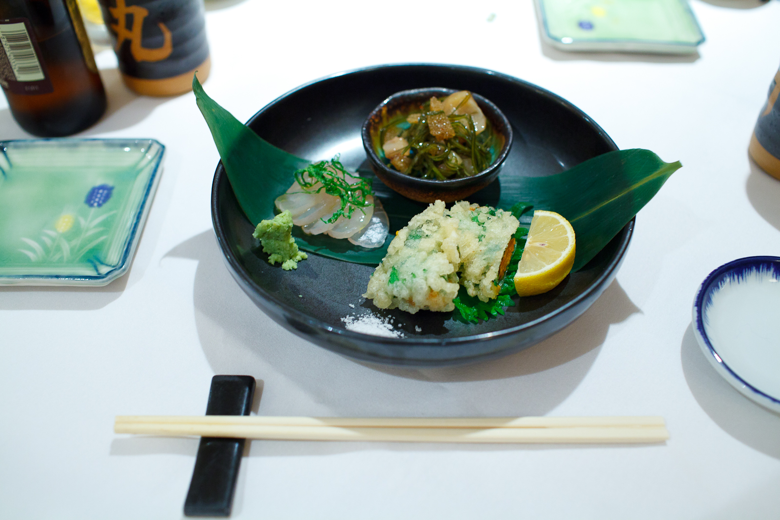 Kelp cured medai, squid, herring roe, seaweed marinated with soy sauce, sea urchin wrapped in shiso tempura ($12)