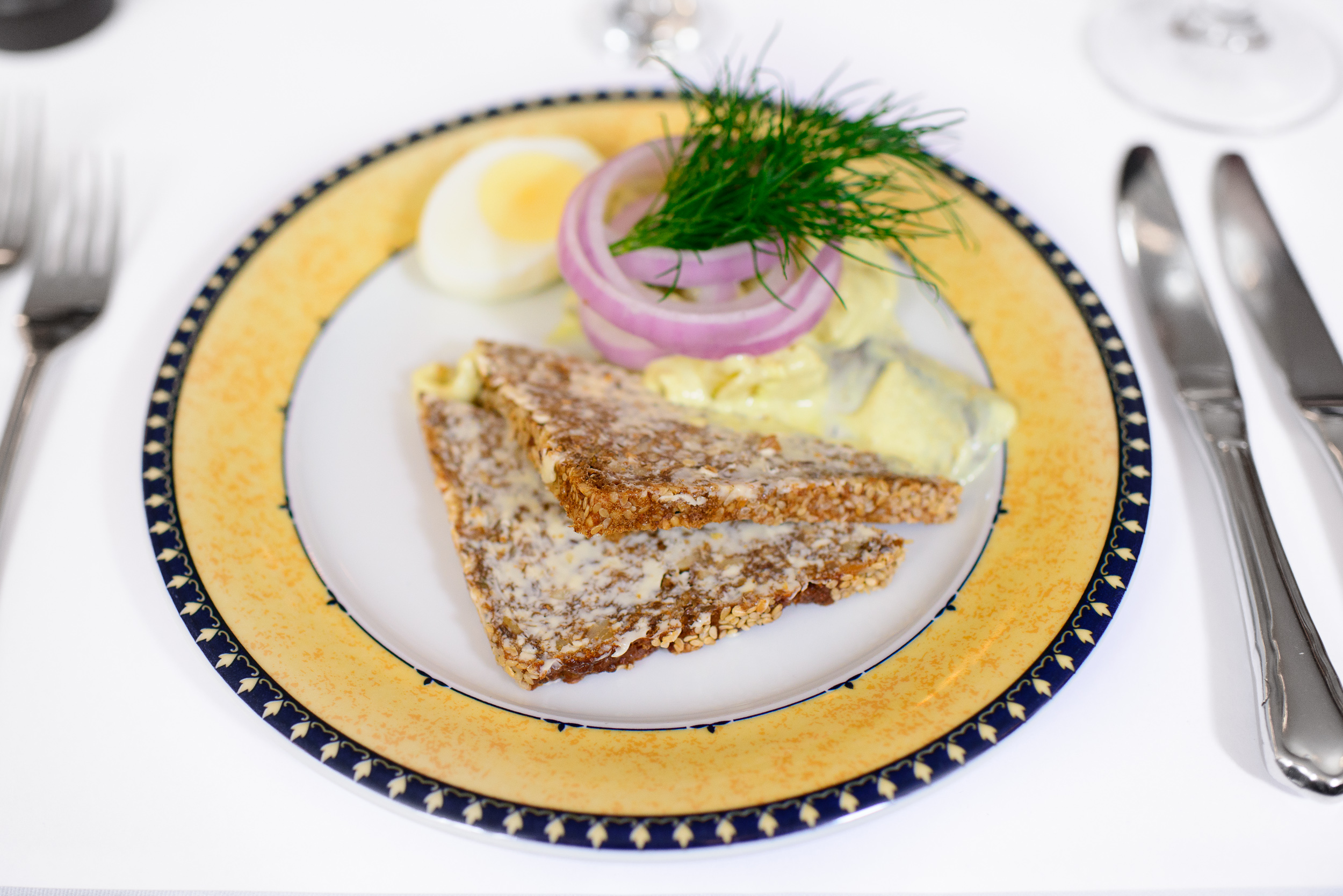 Curry-spiced herring of the house, served with egg