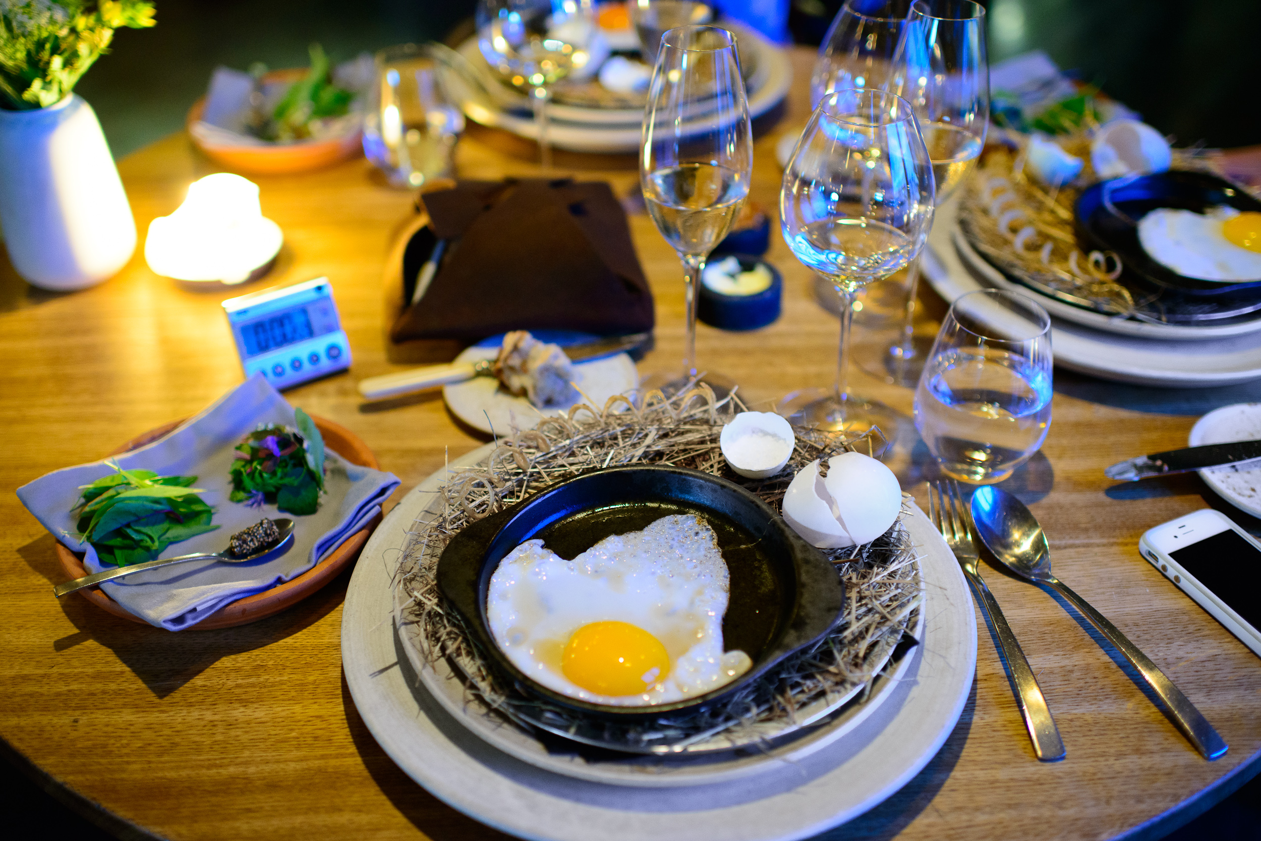 26th Course: Egg yolk and herbs - duck egg frying at the table