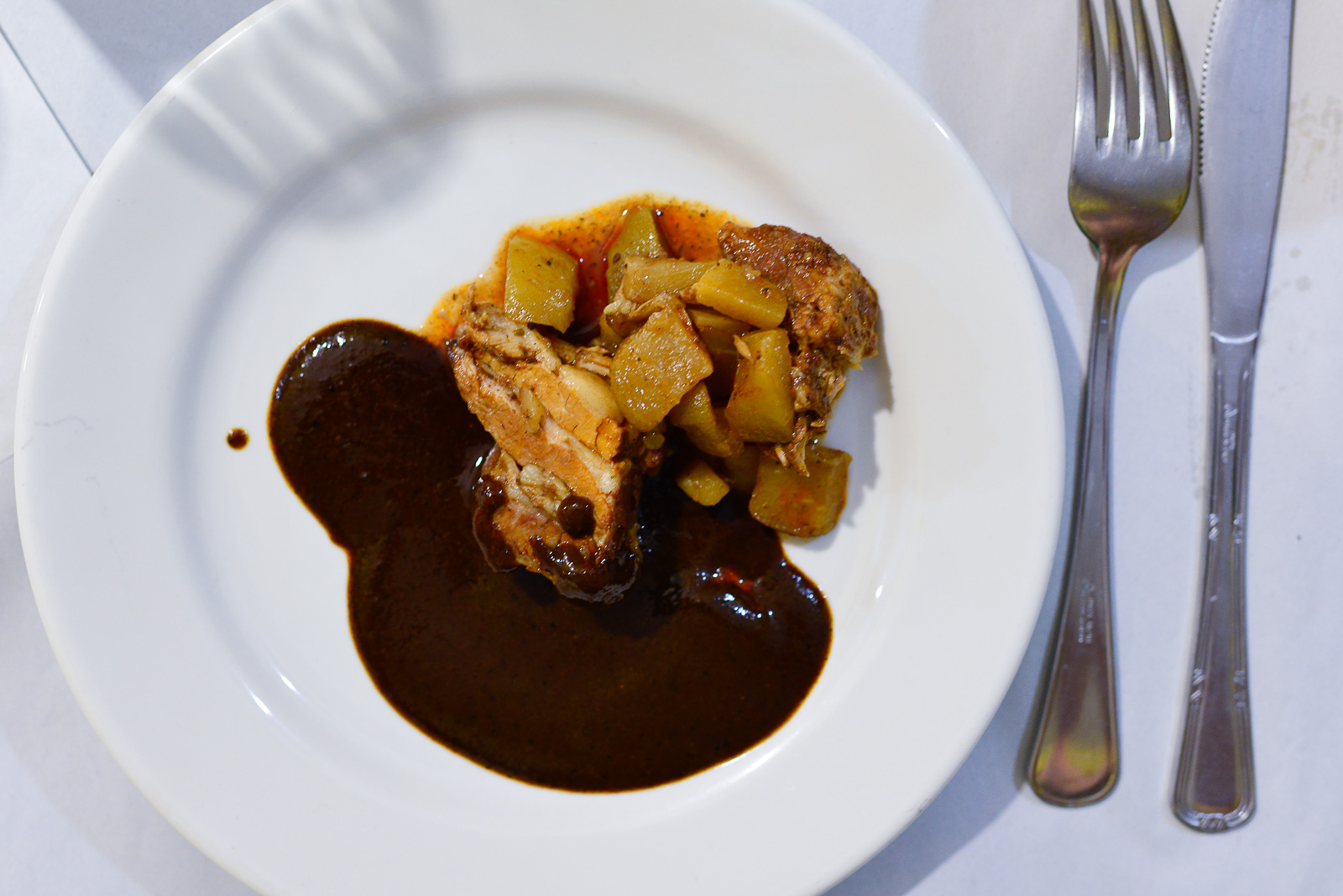 Asado de puerco con mole negro (pork roasted with black mole fro