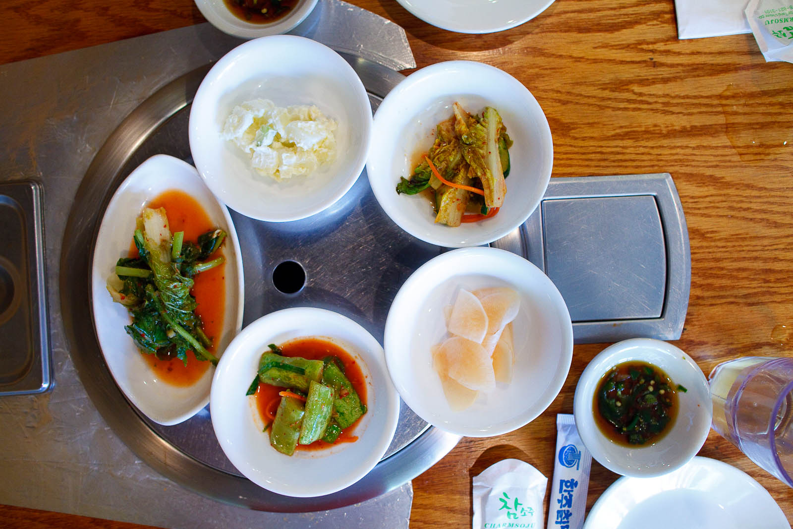 Banchan assortiment - gamja jorim (potato salad), kim chi, mu kimchi, oi sobaeji (cucumber kimchi), yeolmu kimchi (young radish kimchi)