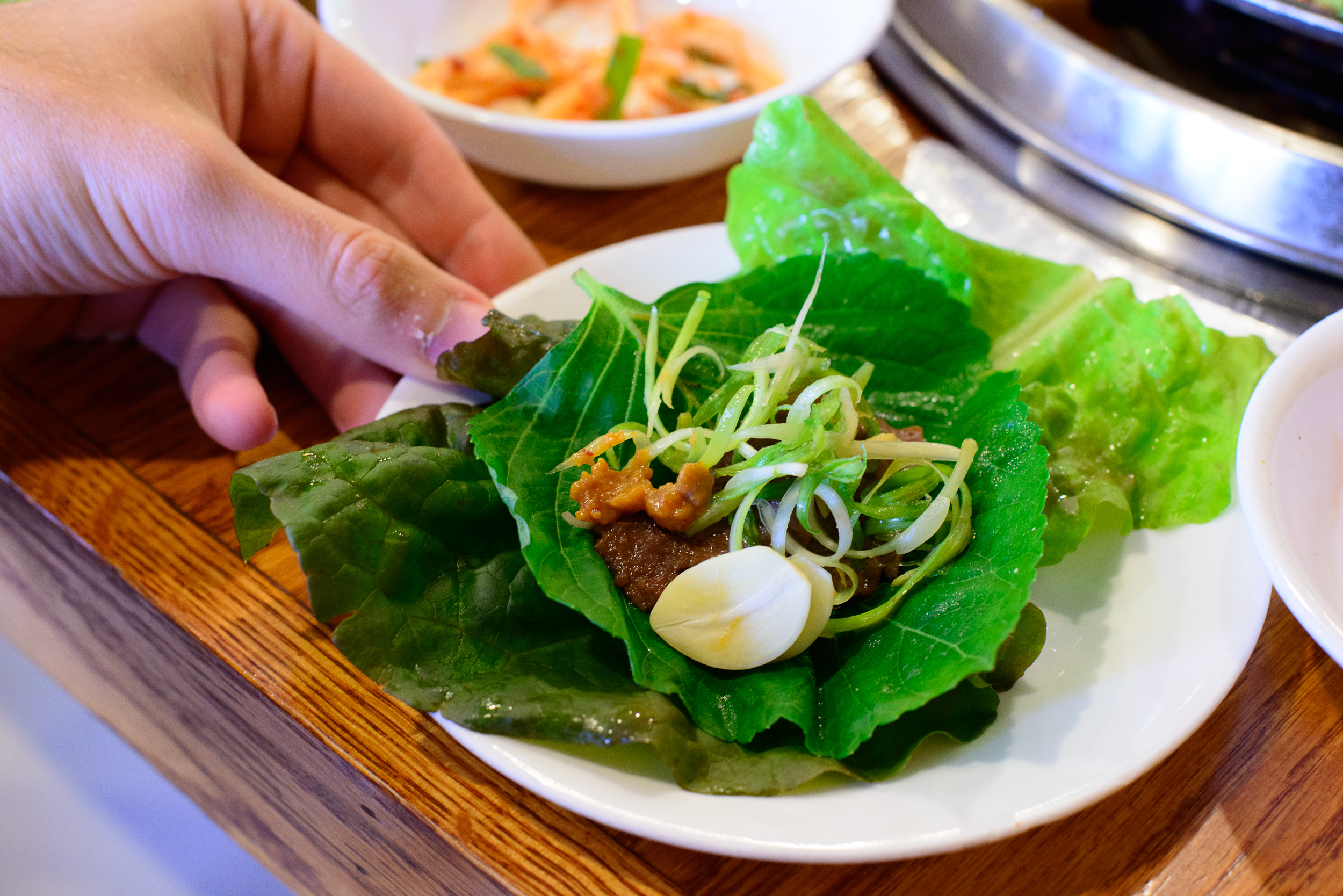 Marinated beef wrapped in lettuce and sesame leaf with miso past