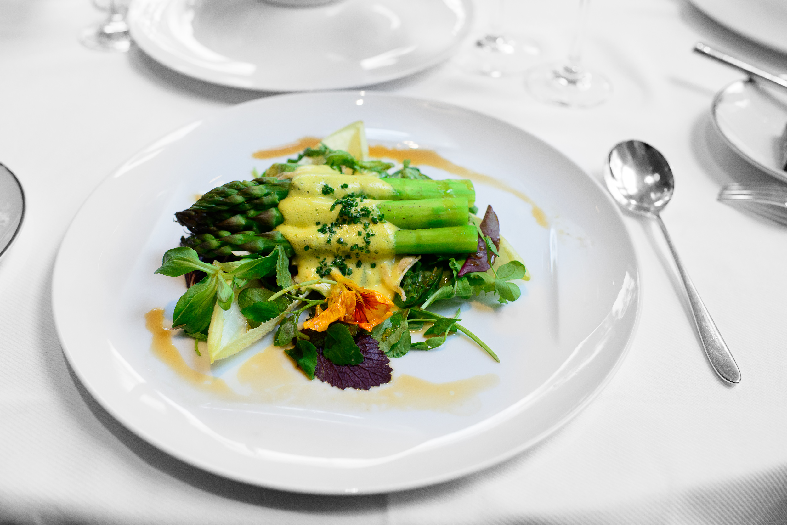 Warm green asparagus salad, hollandaise, truffle vinaigrette