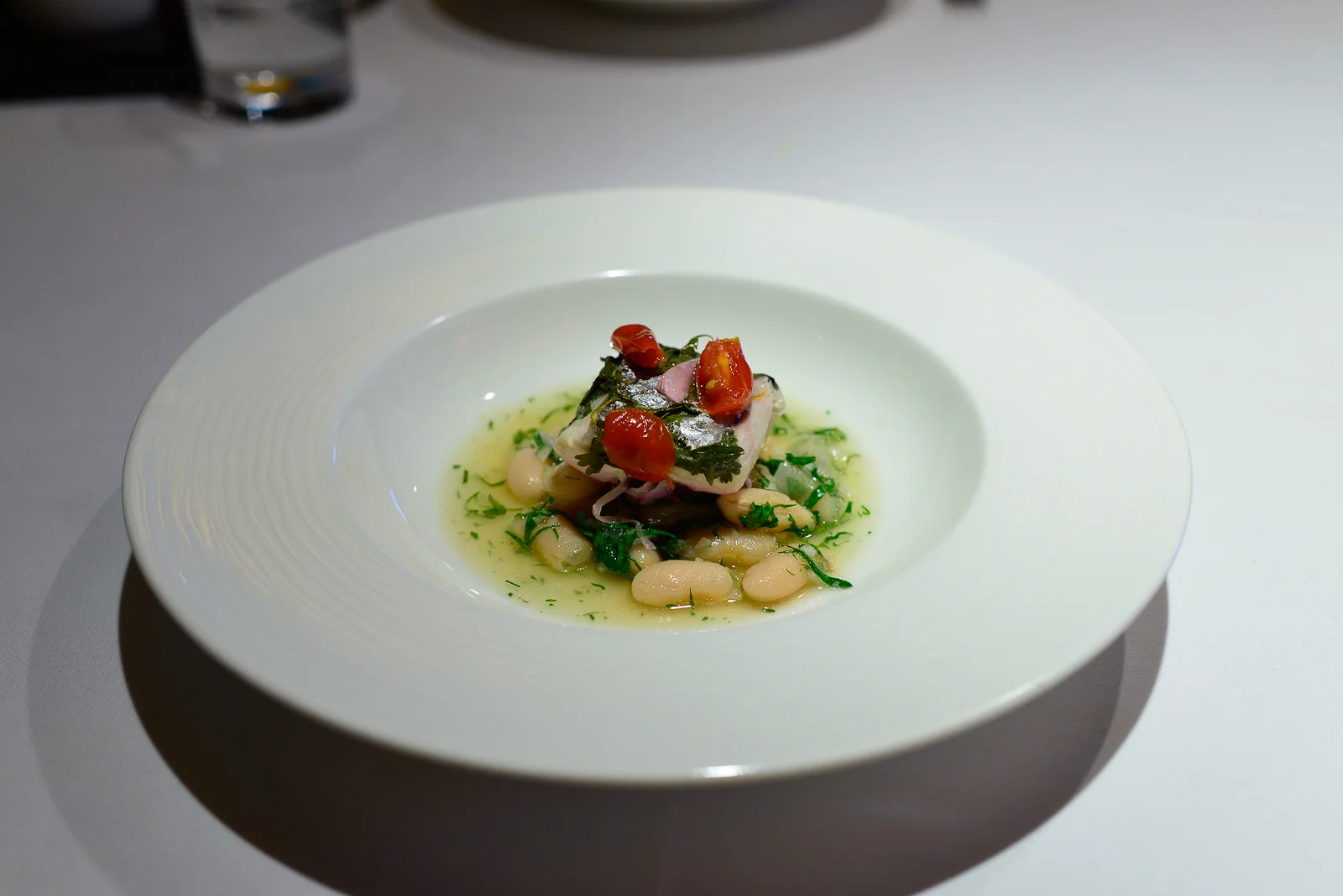9th Course: Pilte de pescado, horned dentro de barrio, acompaña