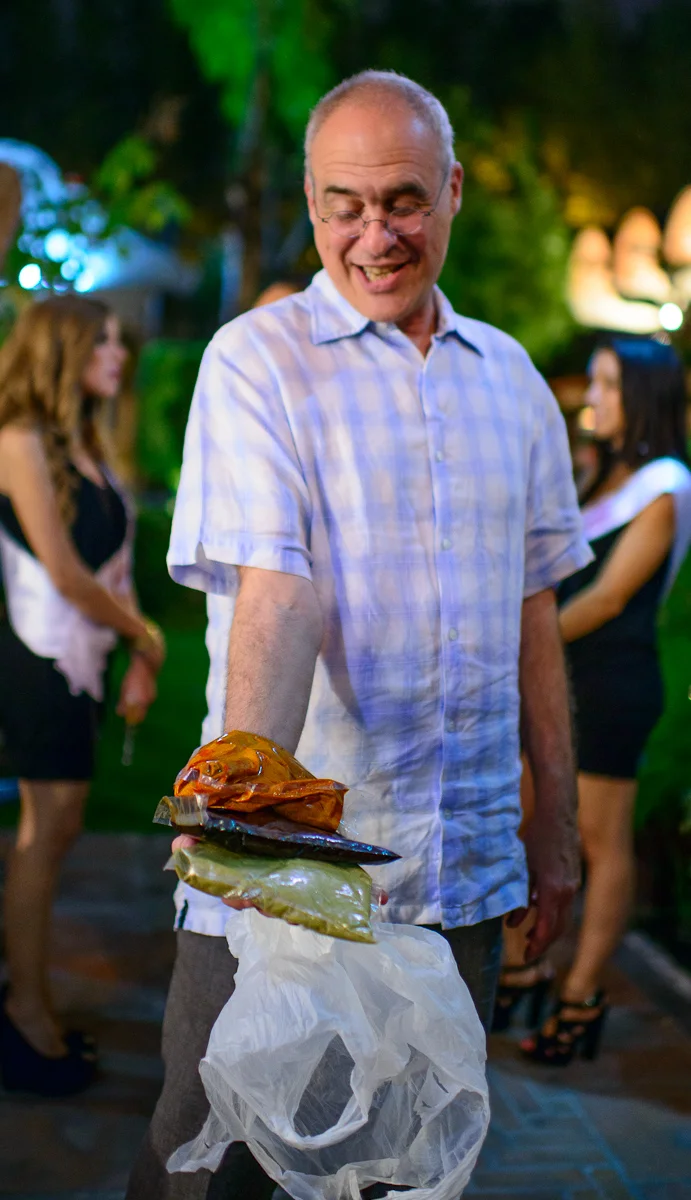 Mark Bittman with bags of pipián rojo, mole poblano, and pipiá