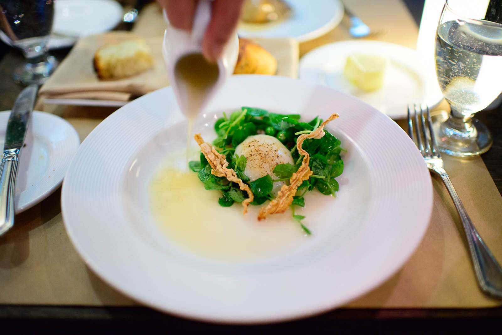 Slow poached egg, braised pork, peas, pecorino and celtuce ($14)