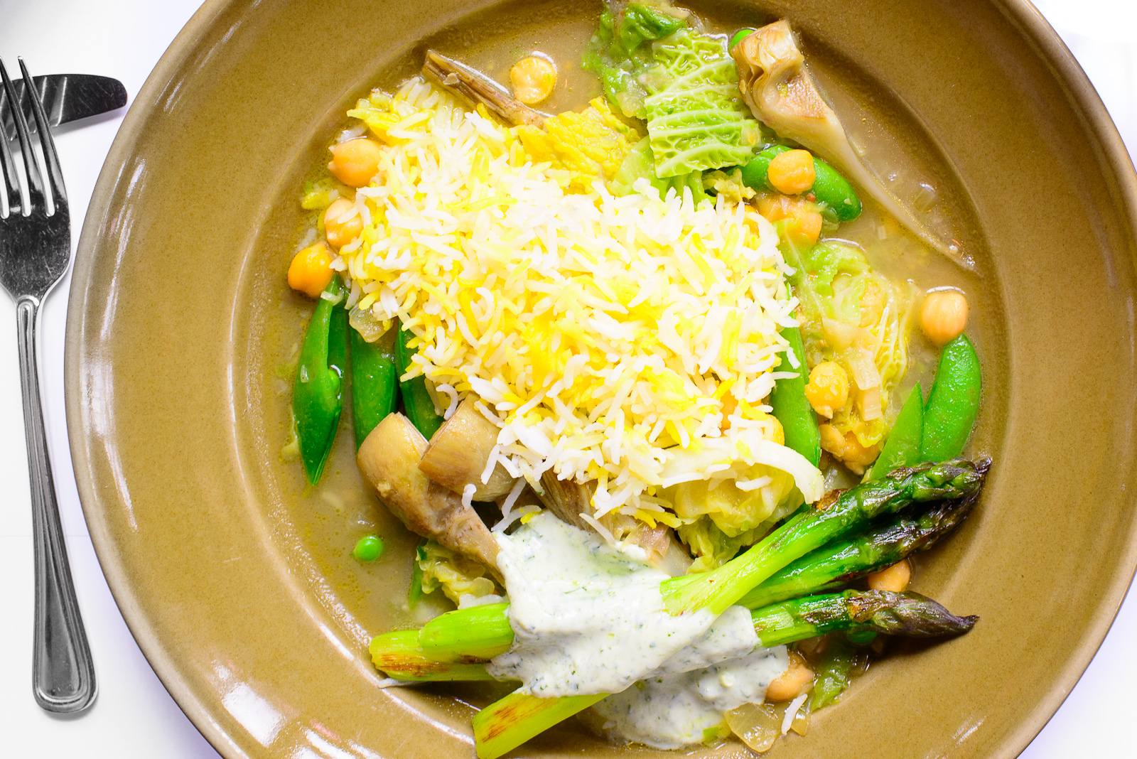 Spring vegetable stew with saffron rice, chickpeas, and mint yog