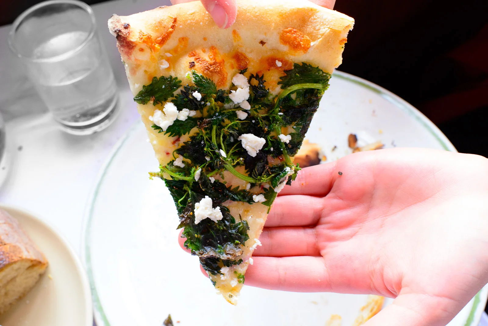 Pizza with wild nettles an ricotta salata, a slice ($18.50)