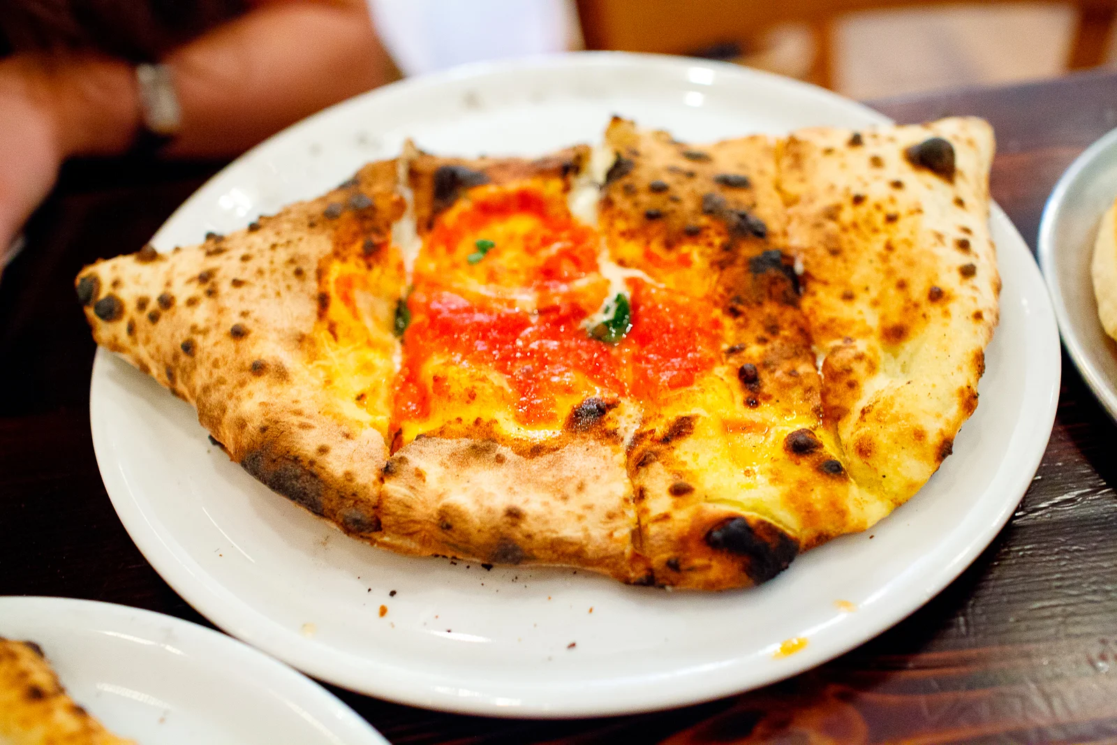 Calzone (smoked mozzarella, soppressata, ricotta) ($15)