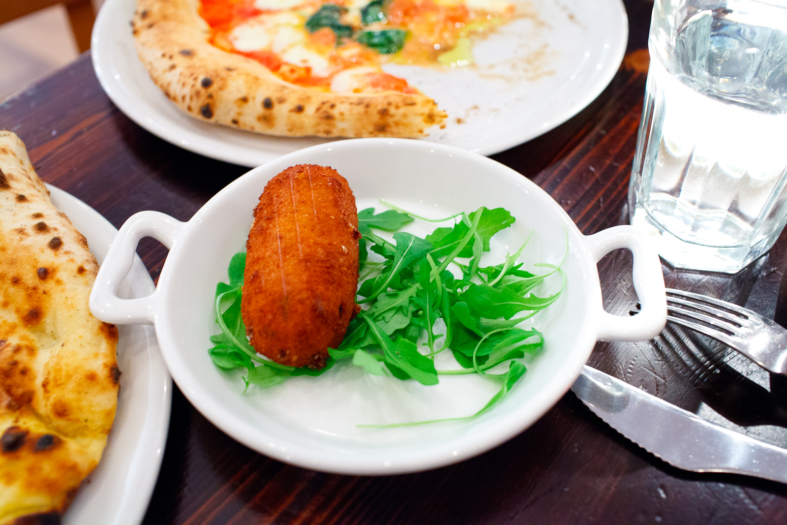 Arancino (tomato and mozzarella rice ball) ($3)