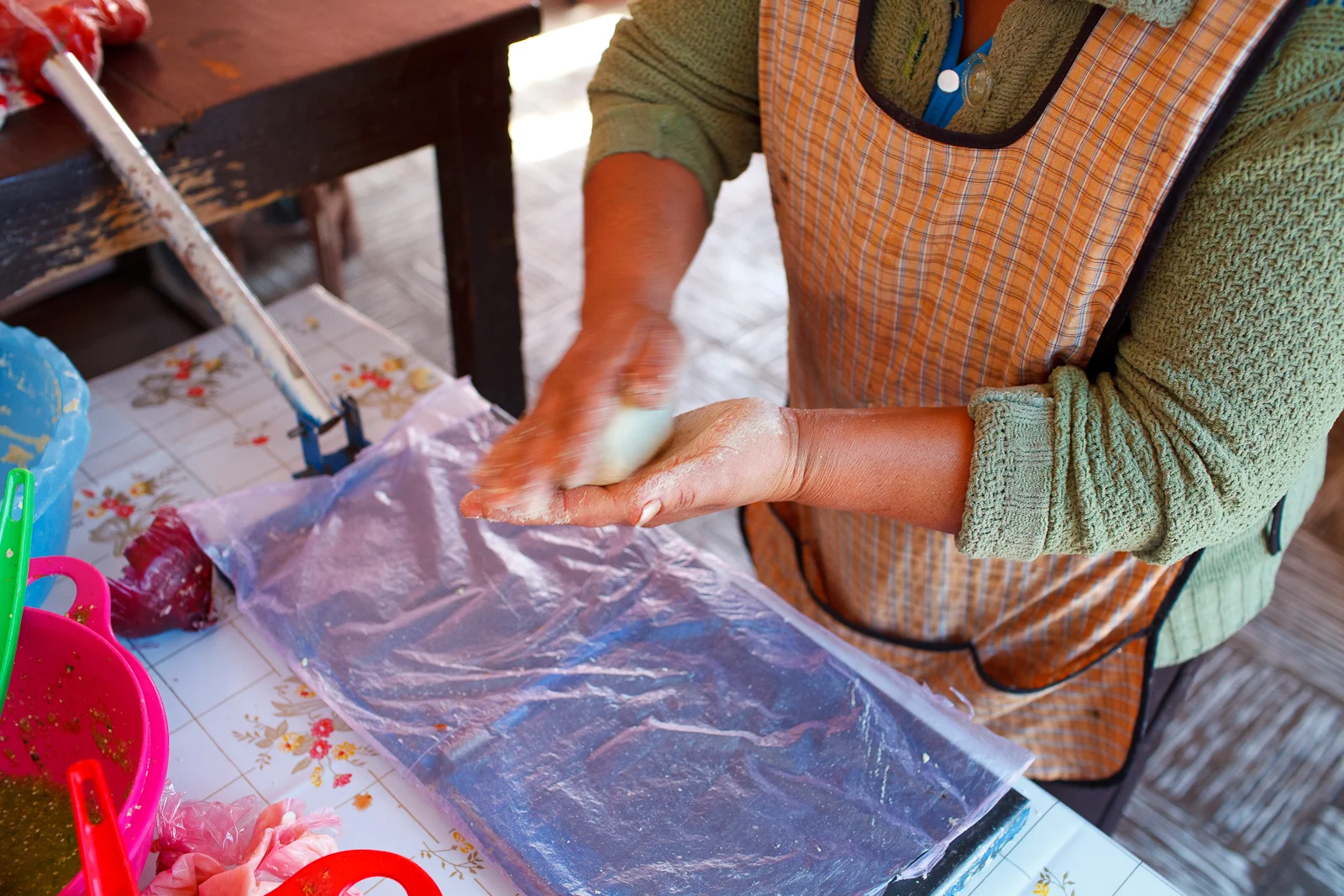 Pressing a tortilla with homemade masa