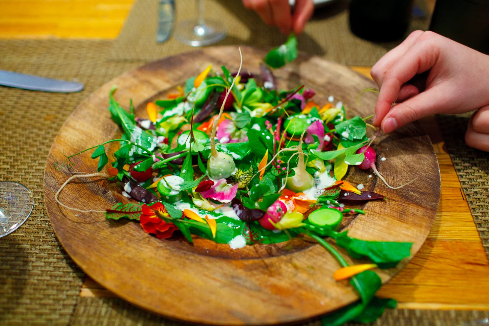 1st Course: Harvest of the day: leaves, flowers, and shoots atop a purée of those vegetables. Eaten with the hands.