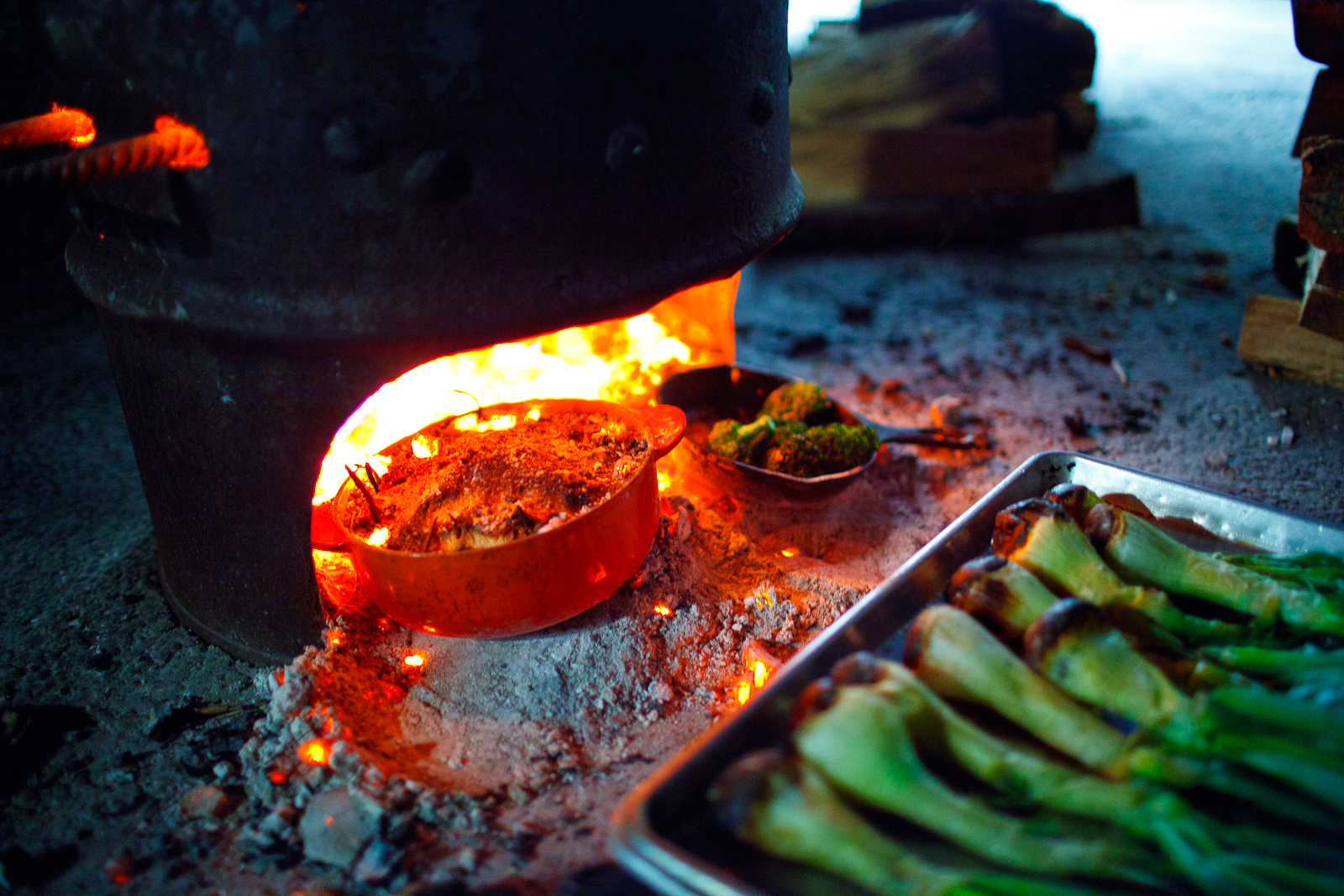 Roasting beets and onions in the fire