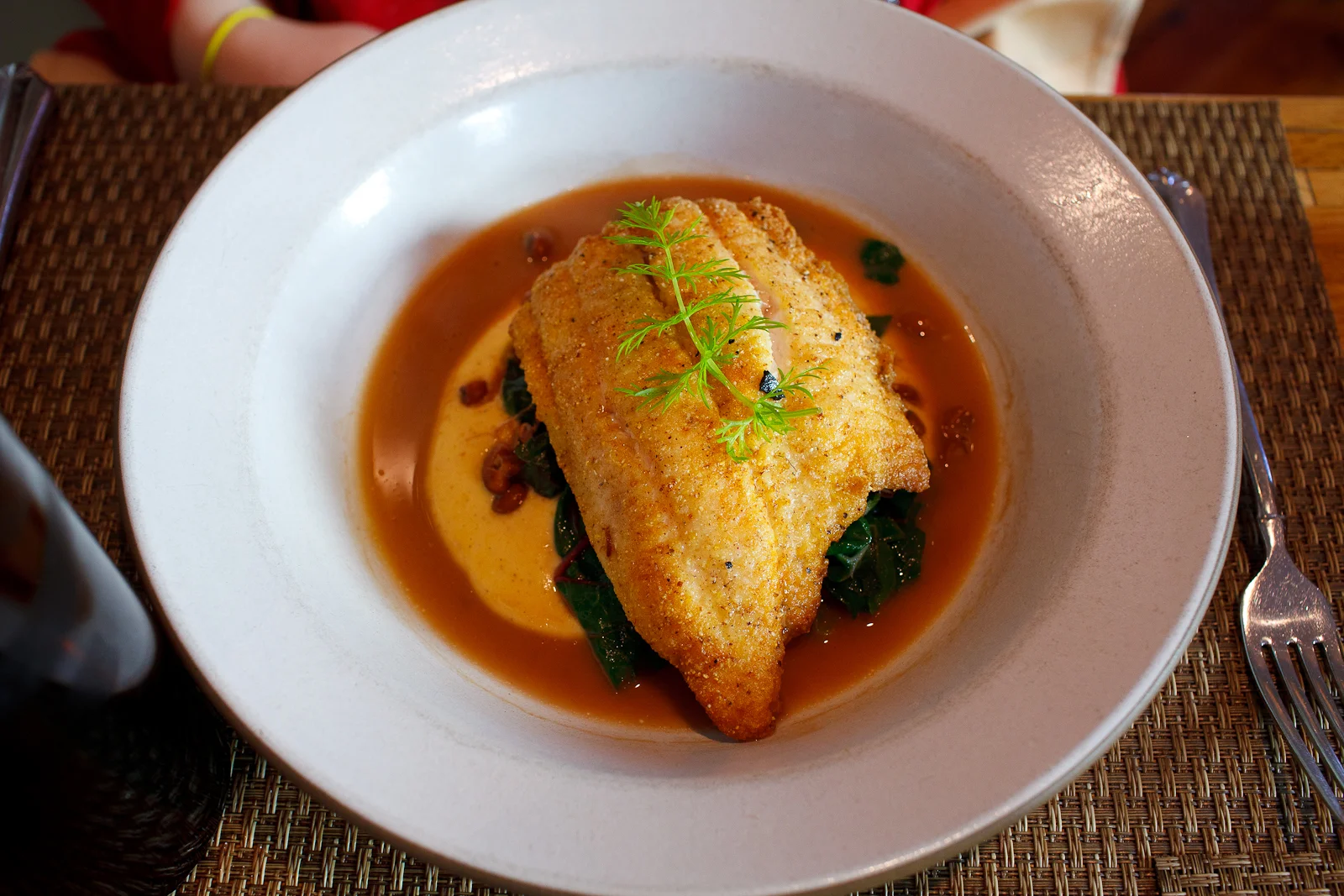Cornmeal Dusted Catfish with Cornbread Puree, Smoky Sea Island Red Peas and Rainbow Chard