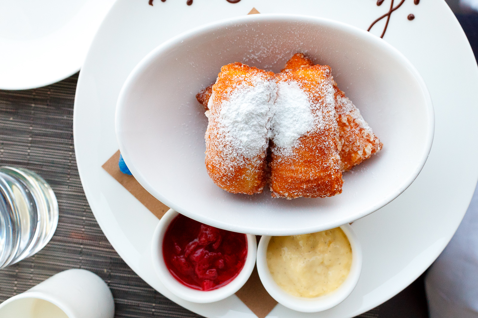 Beignets, vanilla custard, strawberry preserves ($10)