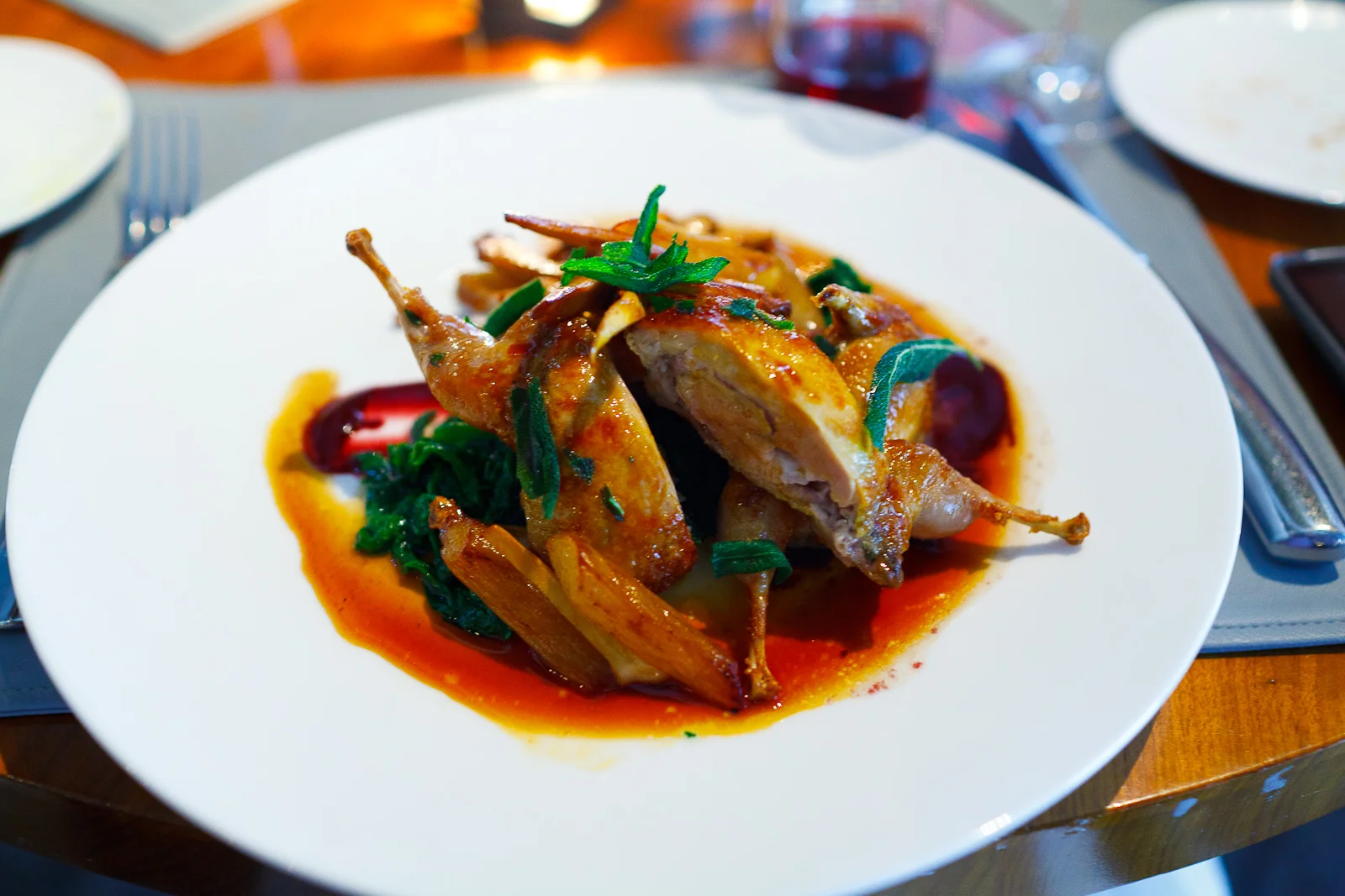 Roasted quail, salsify, concord grapes, mustard greens, chanterelle mushrooms ($29)