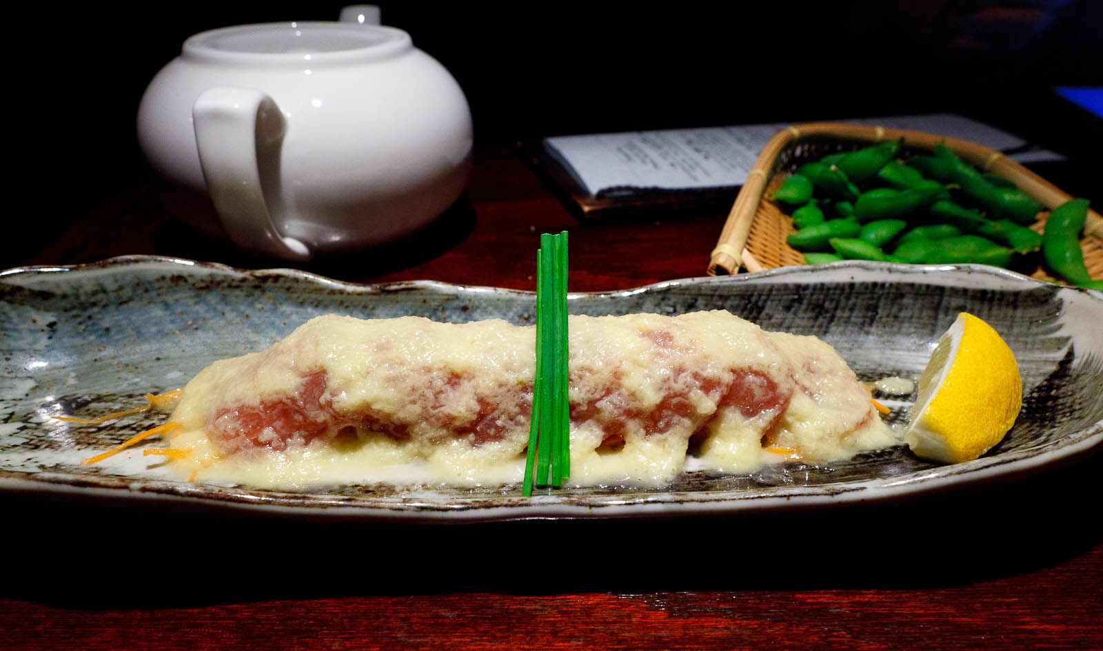 Maguro Carpaccio: medium fatty tuna sashimi, green yuzu pepper sauce ($14.95)