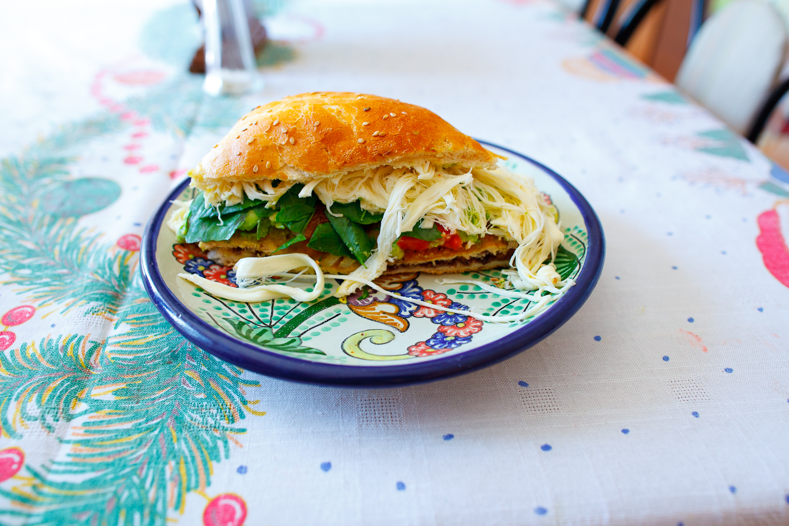 Cemita de milanesa con rajas, chipotle, y frijoles (breaded chicken sandwich with chiles, chipotle, and refried beans) (35 MXP)