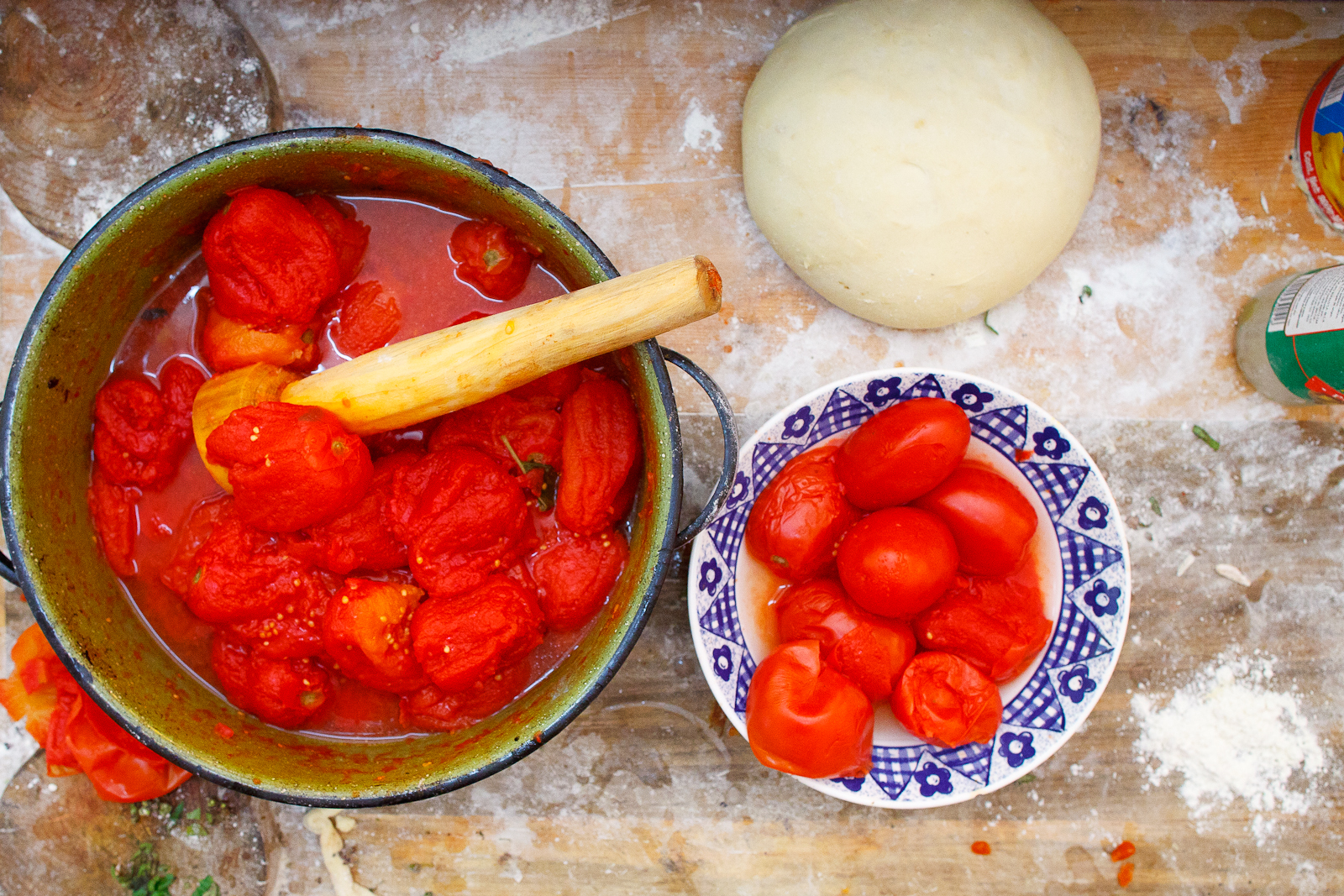 Crushing fresh tomatoes for sauce