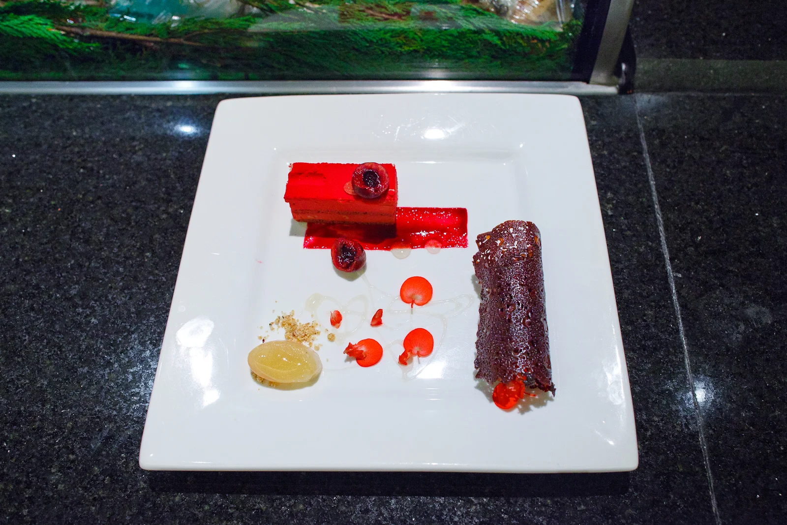 Black cherry bavarian cream and biscuit sac her over a black current stroke, accompanied with gianduja cream and gold serbet (95 MXP)