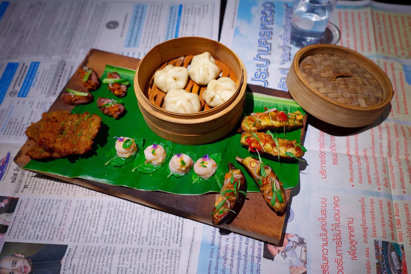 1st Course: Roasted banana (fried garlic, pickled shallot, cilantro blooms), prawn cake (white pepper, coriander, lime zest), sweet shrimp (raw garlic, mint, bird chills), fermented sausage