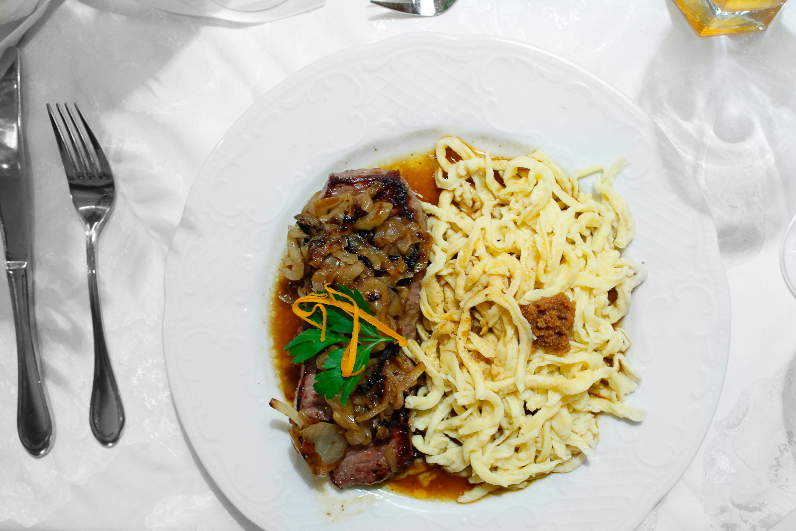 3rd Course: Zwibeltostblaten hit handgeschabten spätzle, lump steak served with fried onions accompanied by handmade spätzle (swabian noodles)
