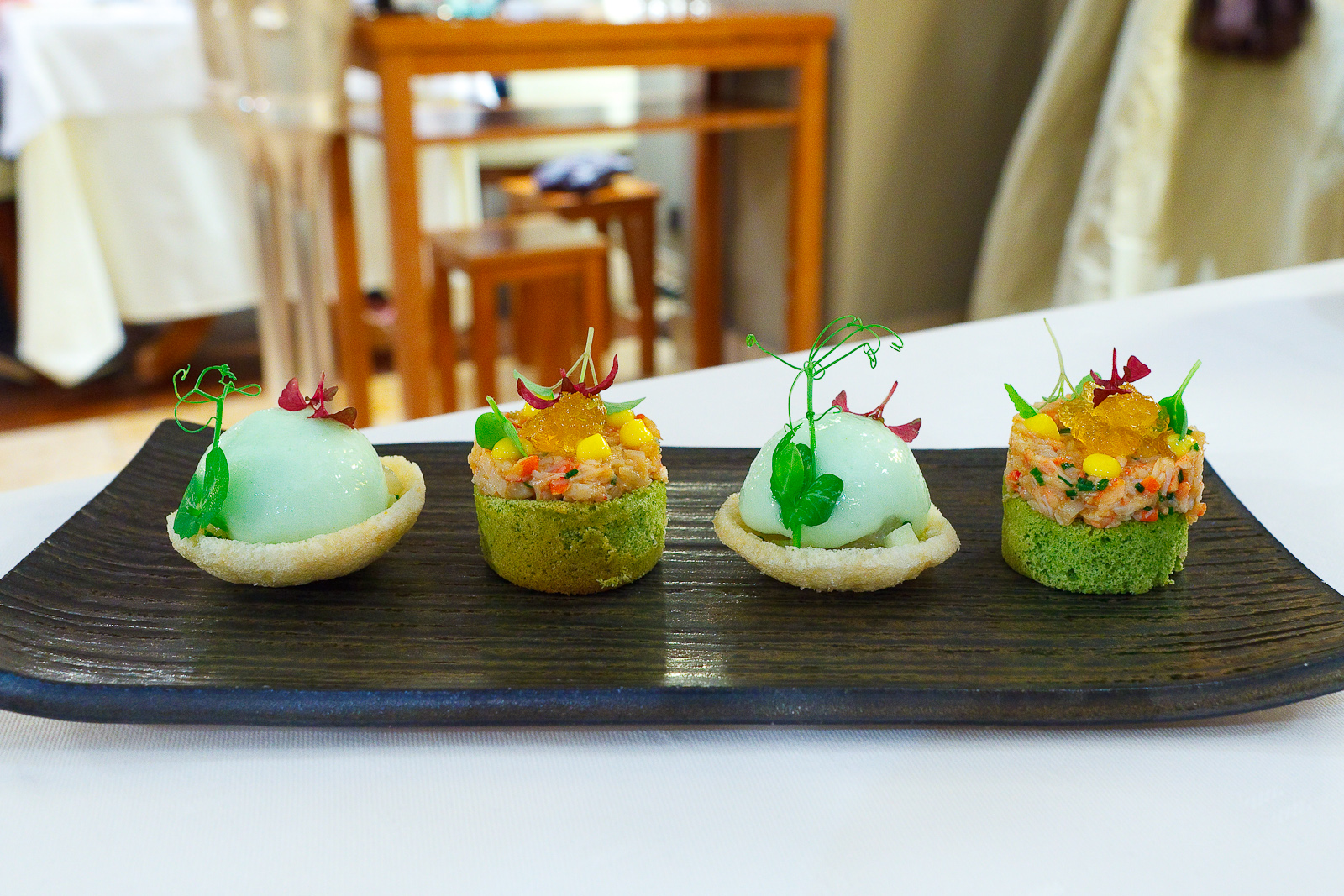Amuse Bouche 6 and 7: Crab cracker with hamachi, fennel, and apple; Green tea biscuit with lobster and kimizu