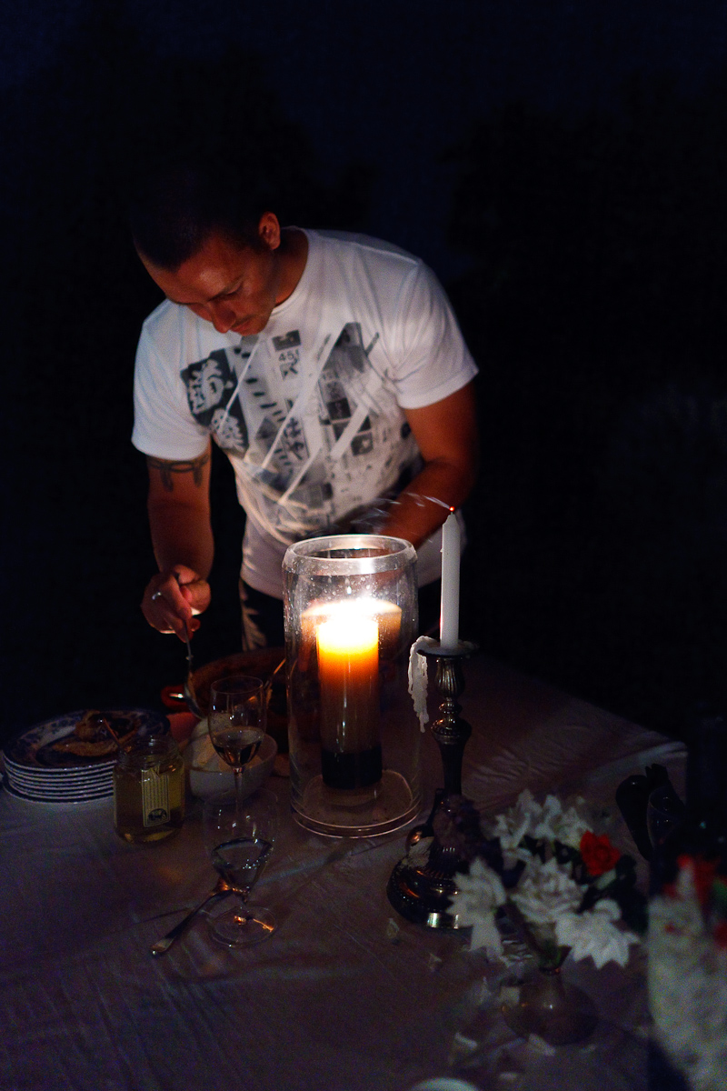 Chef Curtis Duffy plating his fig tart with a dollop of mascarpone, al fresco