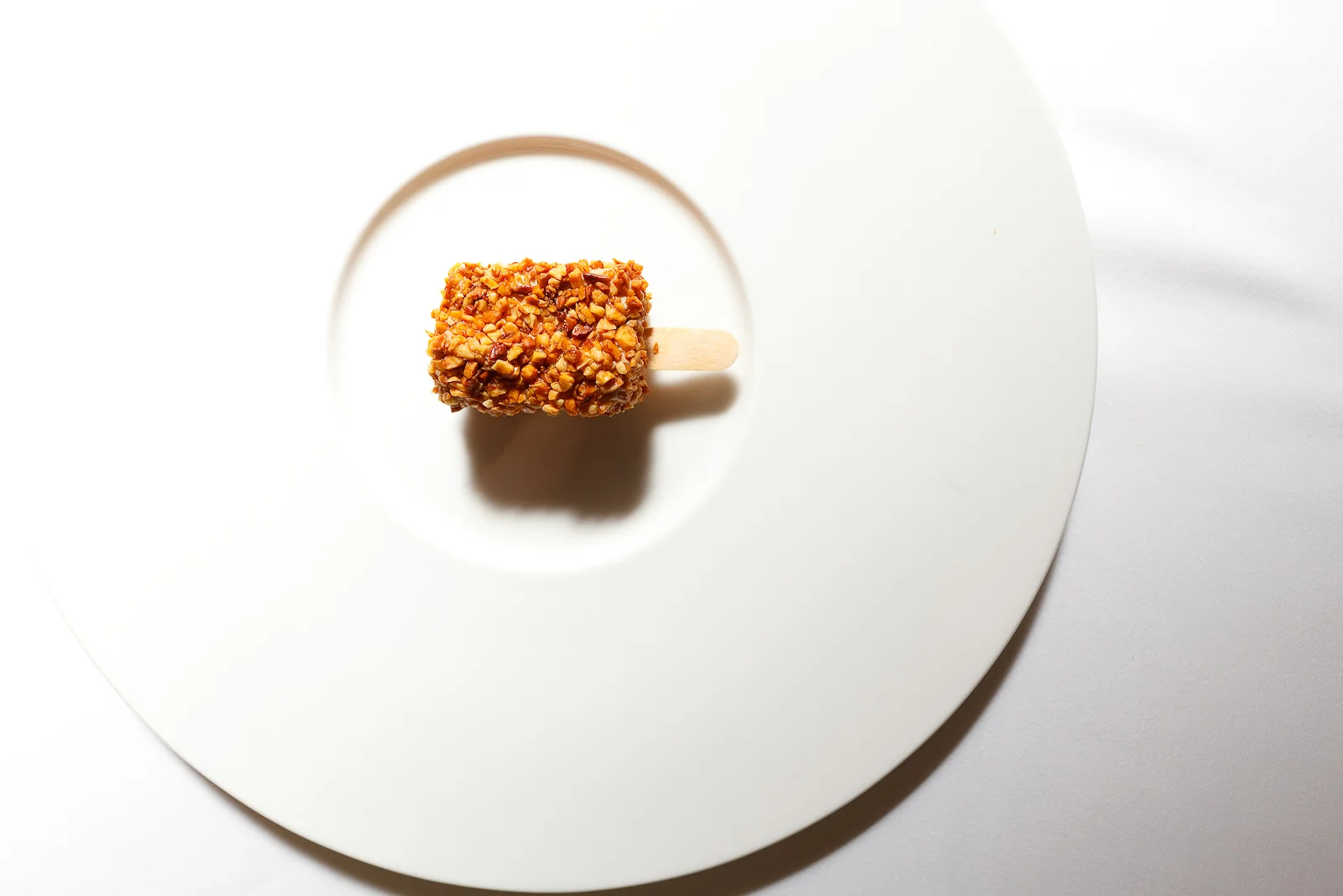 10th Course: Foie gras crunch with almonds from Noto, igp hazelnuts from Piemonte, injected with 40-year aged balsamic vinegar