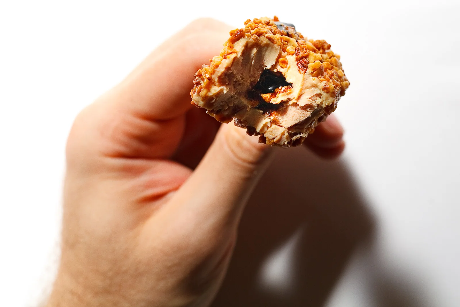 10th Course: Foie gras crunch with almonds from Noto, igp hazelnuts from Piemonte, injected with 40-year aged balsamic vinegar, interior shot