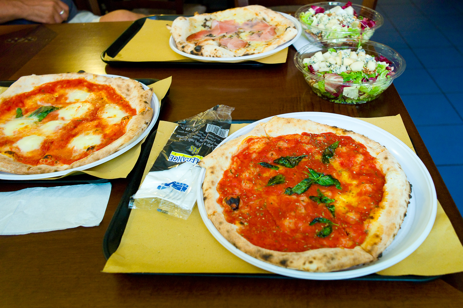 Pizza margherita, pizza marinara, pizza with speck and tomato, walnut salad