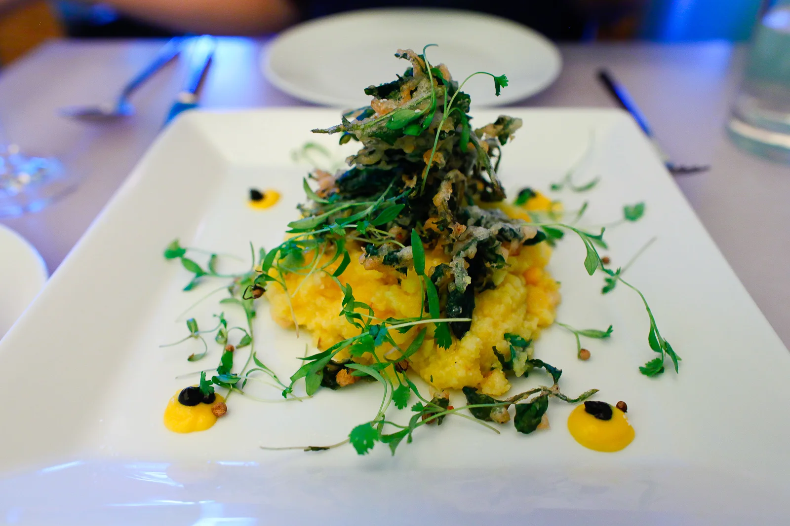 Corn - stone ground grits, tempura poached egg, corn cream, pickled shiitakes ($18)