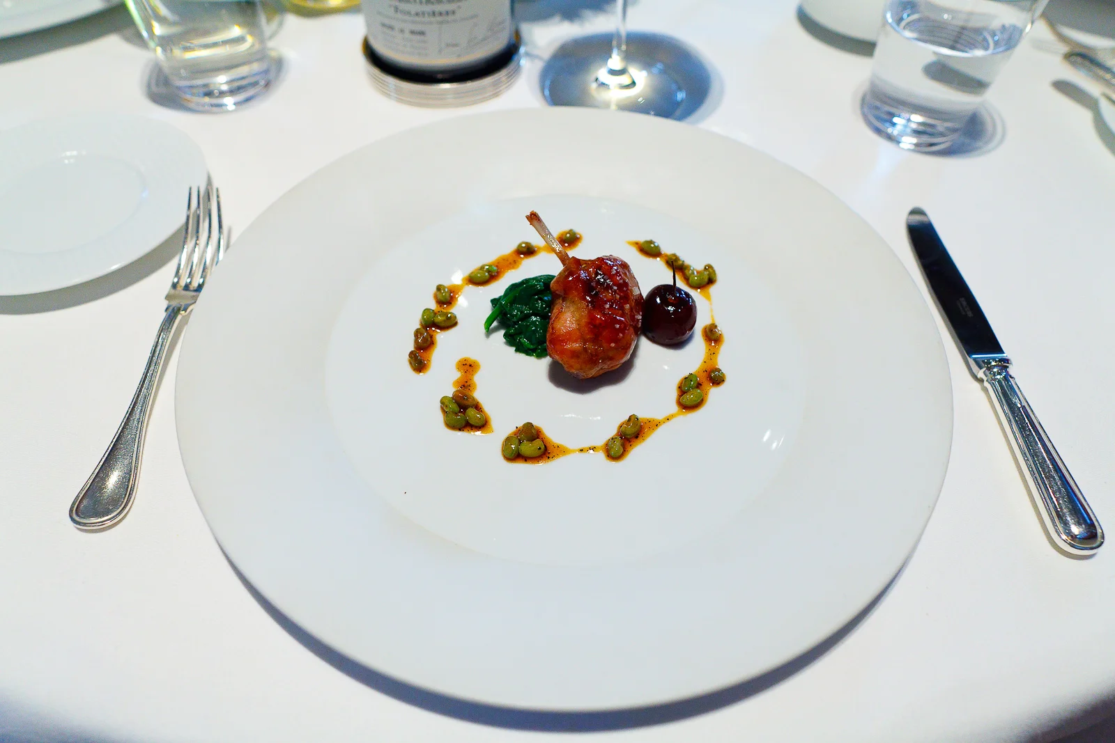 6th Course: Devil's Gulch Ranch "Épaule de Lapin," Black Eyed Peas, Arrowleaf Spinach, Glazed Bing Cherry and Black Truffle-Maple Jus