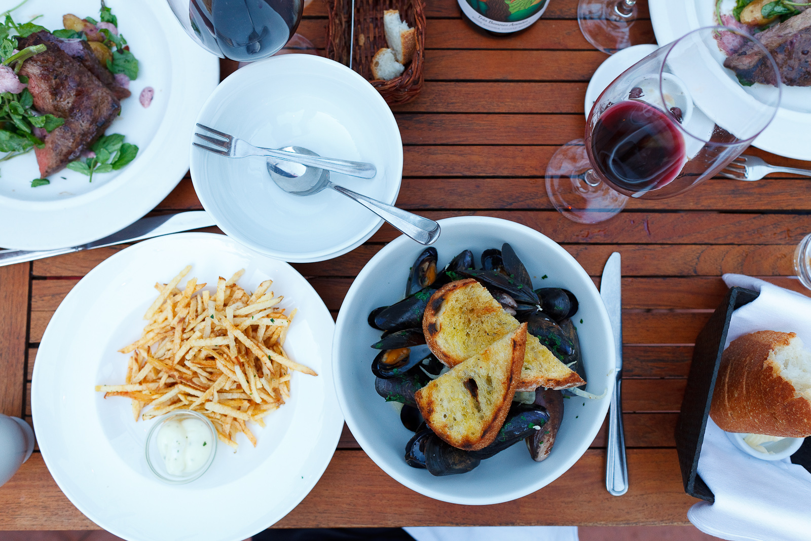 Pastis-scented steamed mussels & frites. garlic, leeks, herbs, grilled bread. full pound 20 half pound ($15)