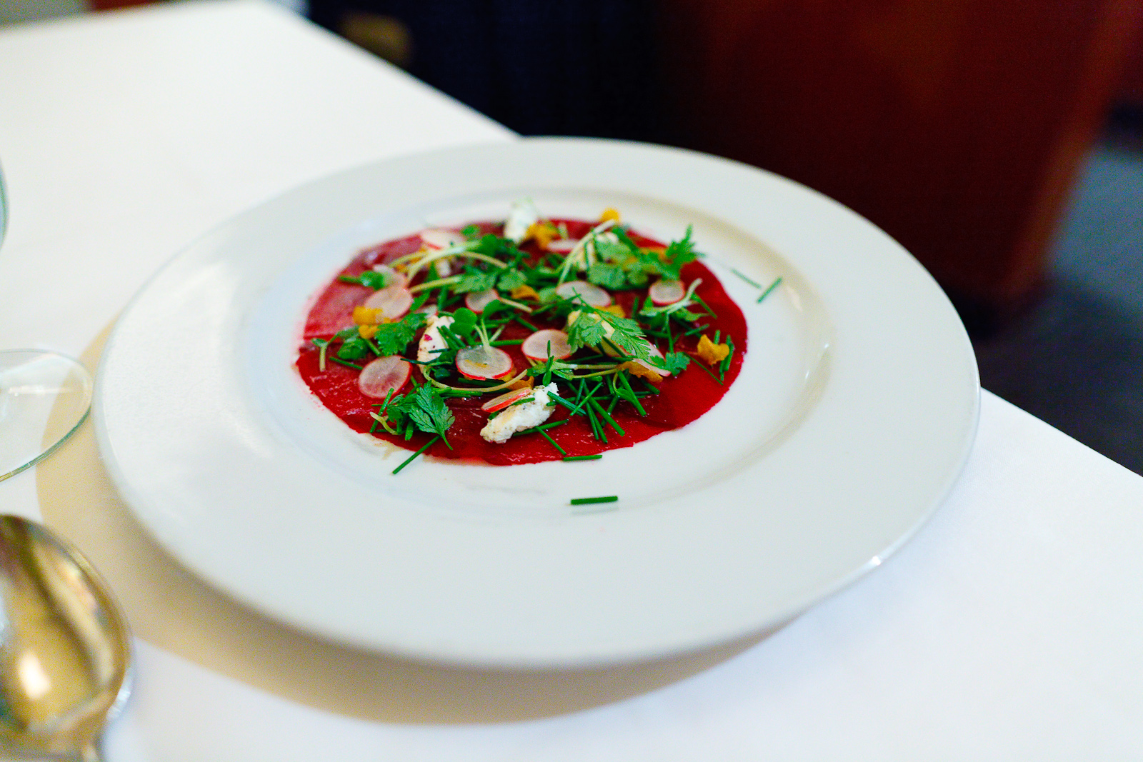 Beet Carpaccio radishes, fresh chevre, sherry vinaigrette ($11.75)