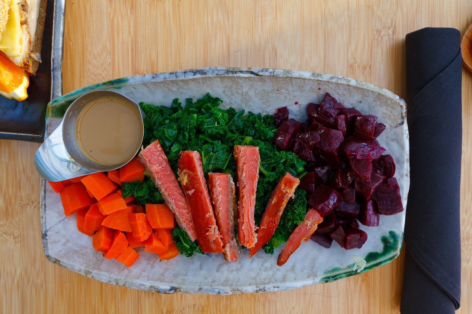 Paleolithic tea service - kale and carrot salad drizzled with tangy sesame dressing, steamed beets, wild salmon ($19)