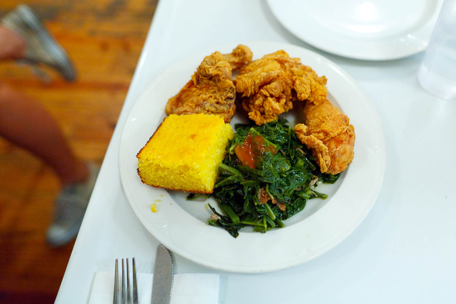 Fried chicken box, corn bread, collard greens ($13)