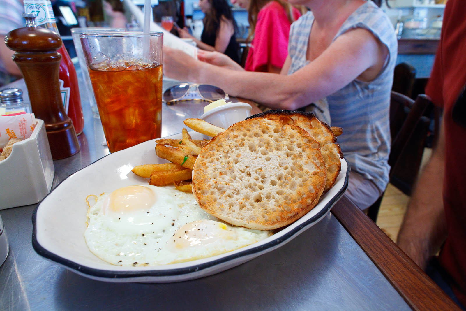 Two eggs over easy, french fries, english muffin ($8.5)
