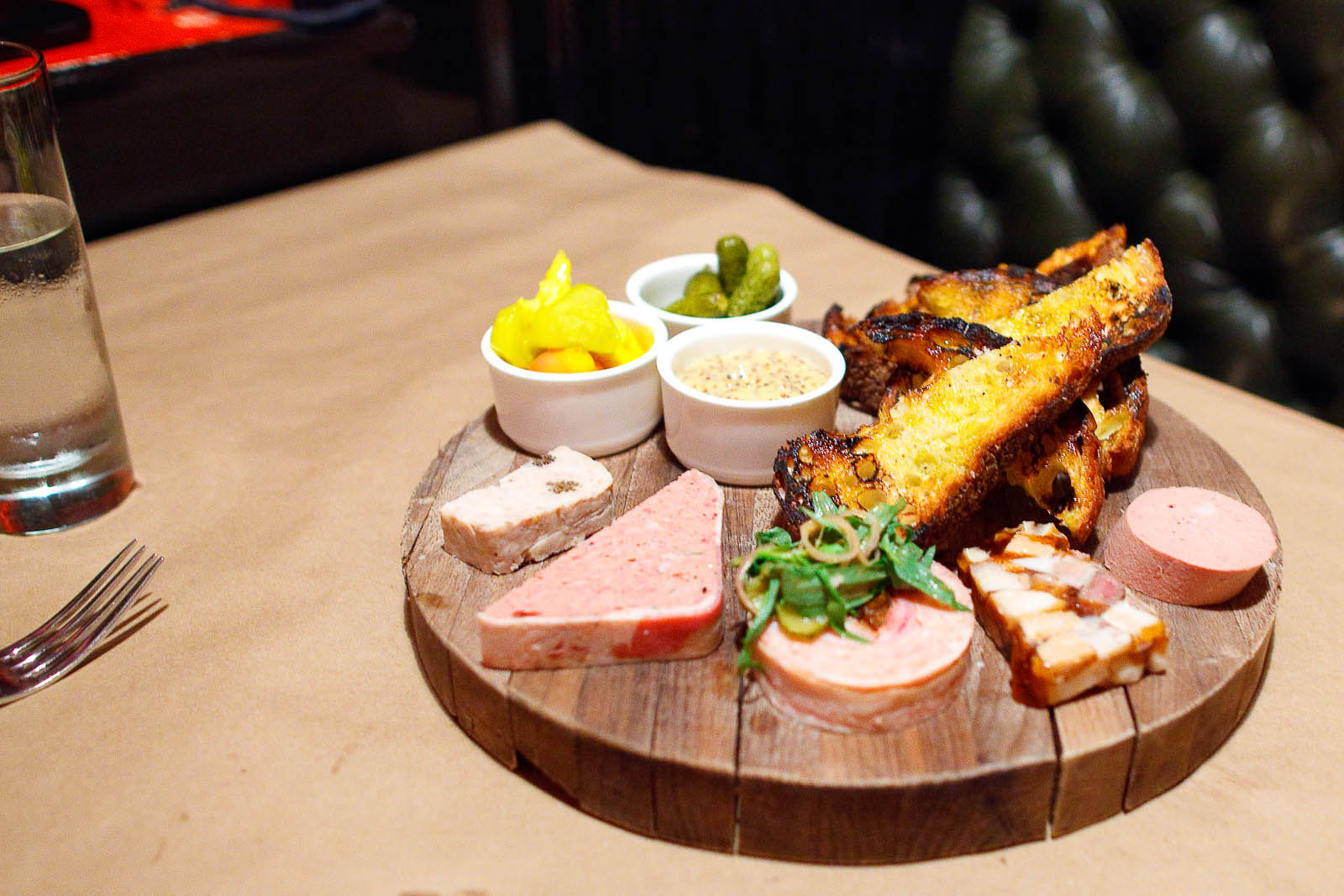 Terrine Board - Guinea hen with morels, Pork pâté, Rabbit and prune, Headcheese, Liverwurst - served with pickles, piccalilli, and mustard ($32)