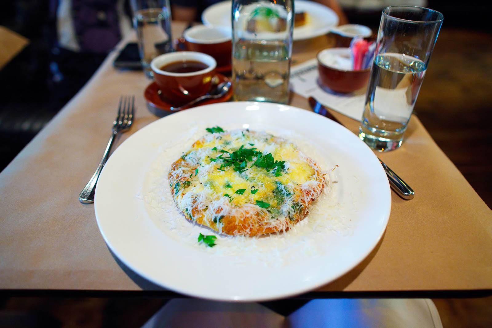 Seasonal frittata with ricotta cheese, sprinkled parmesan ($16)