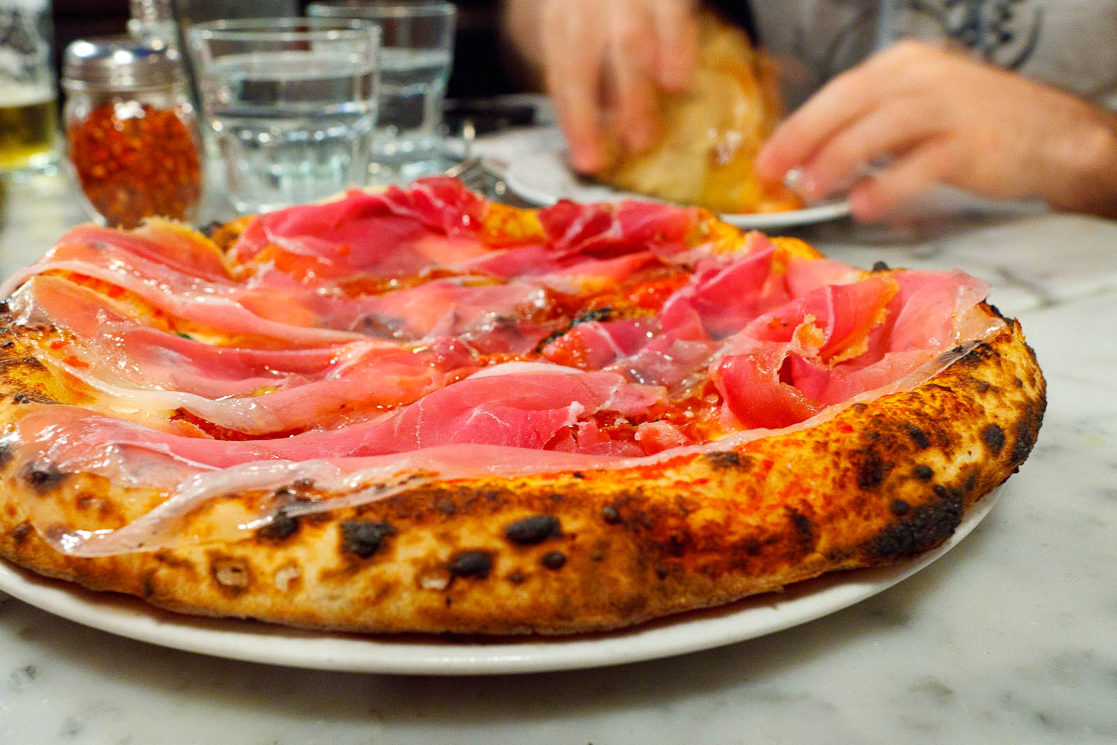 Pizza Soppressata Piccante - tomato, fior di latte, red pepper flakes, garlic ($15)