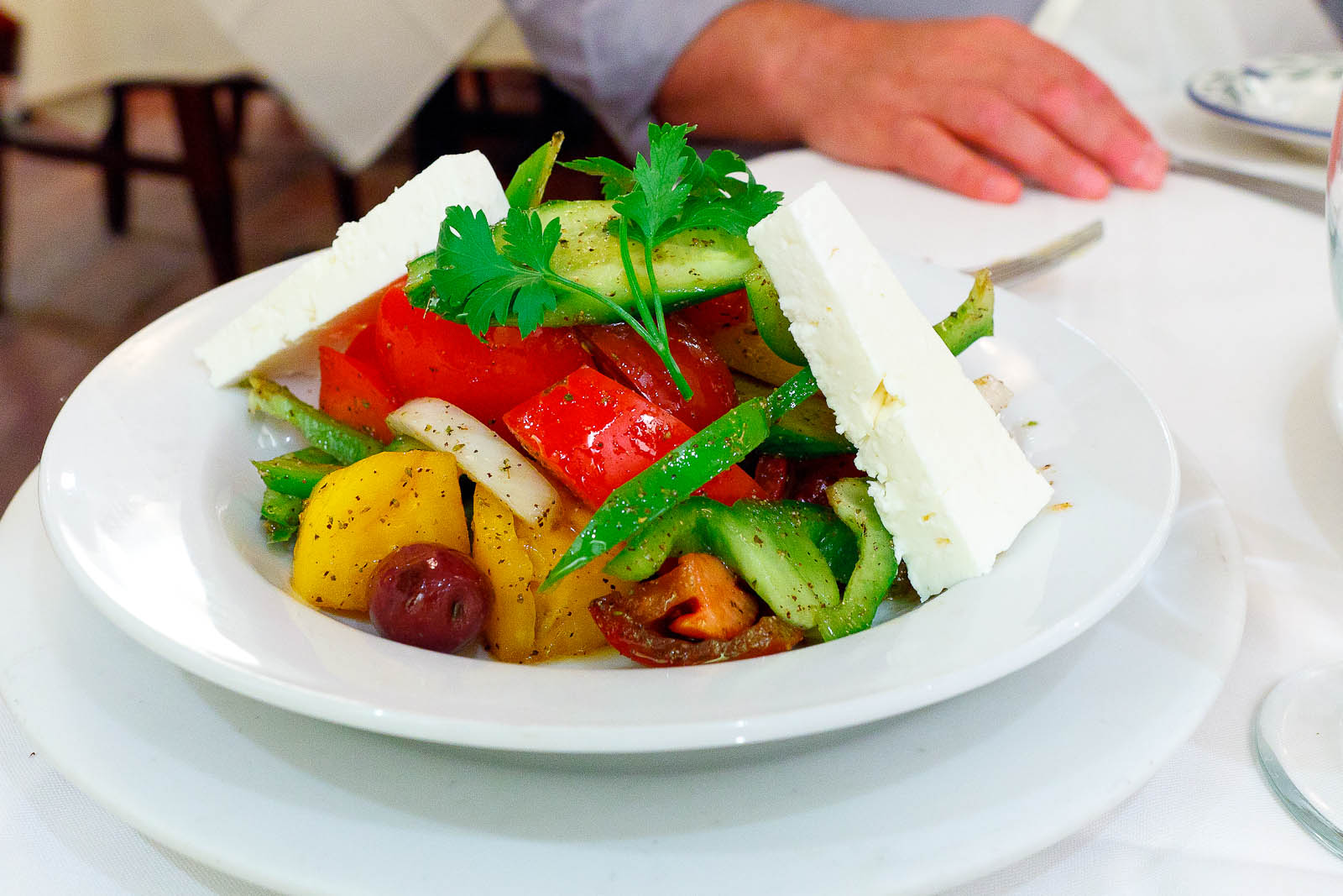 Greek salad - classic salad with vine-ripened tomato, cucumber, pepper, onions, Kalmata olives, and feta cheese ($15.95)